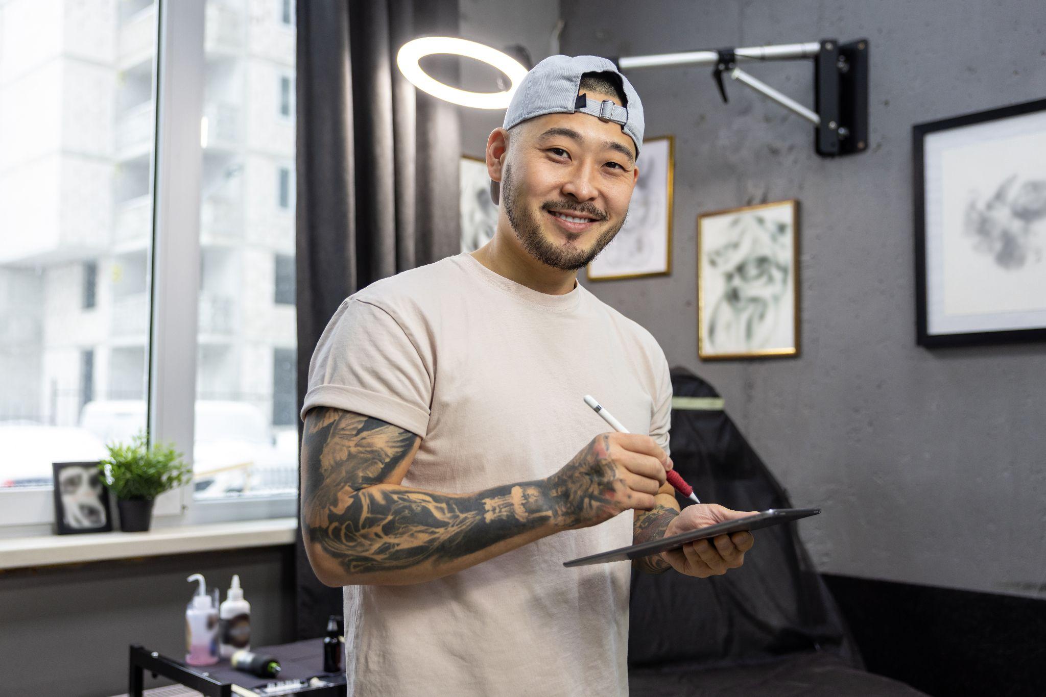 Happy tattoo artists at work