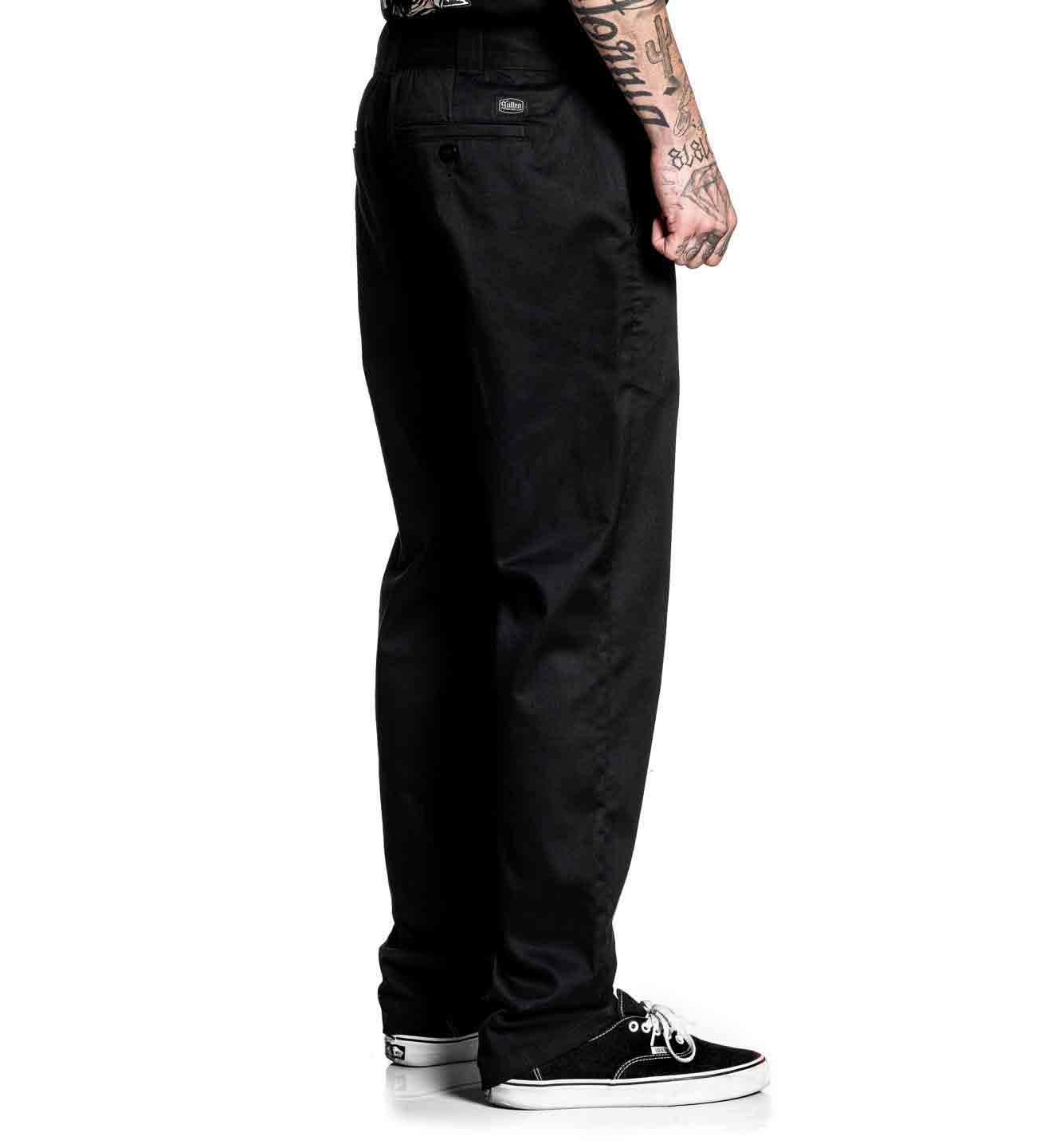 Person wearing black pants on a white background