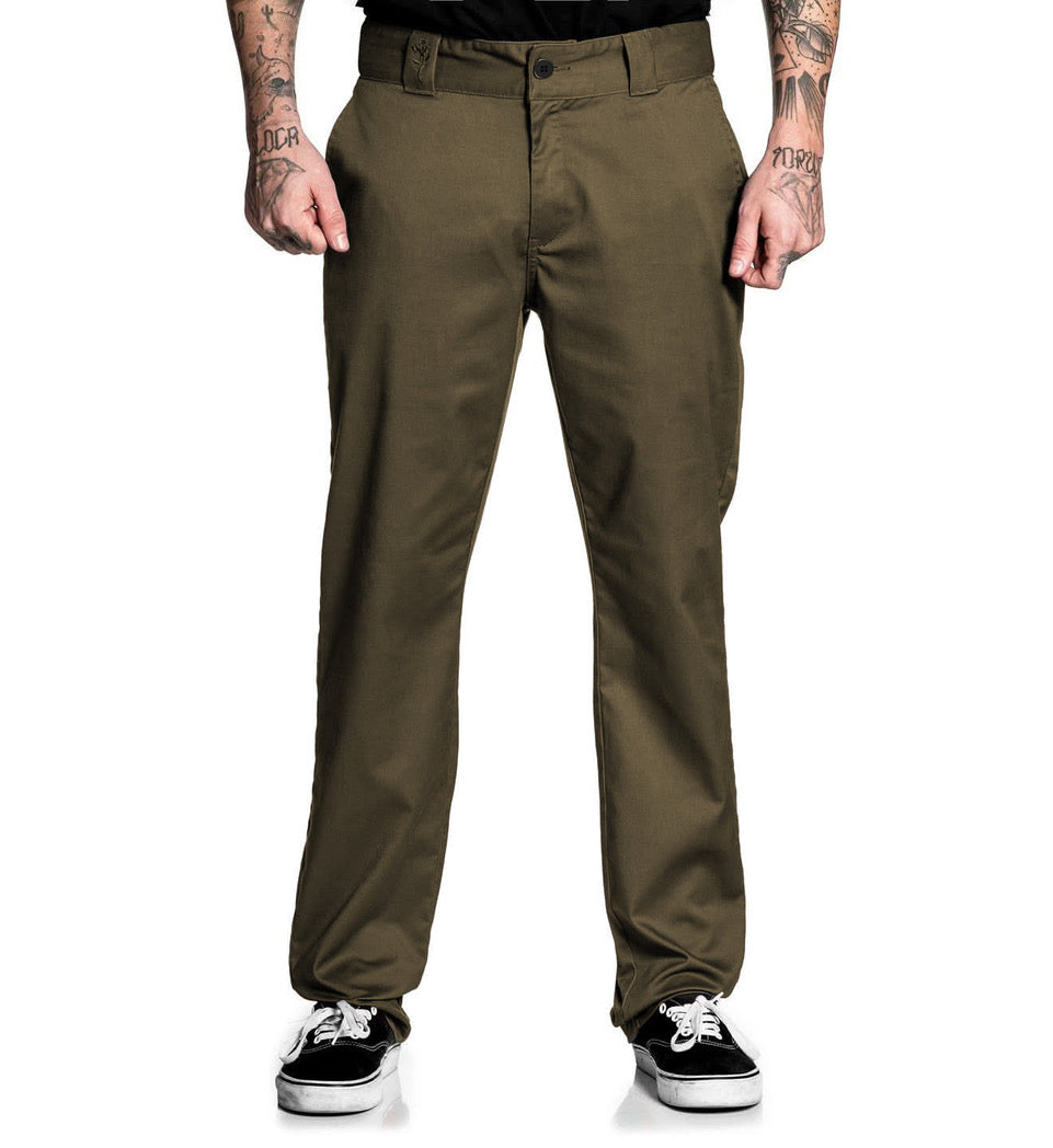 Person wearing olive green pants on a white background