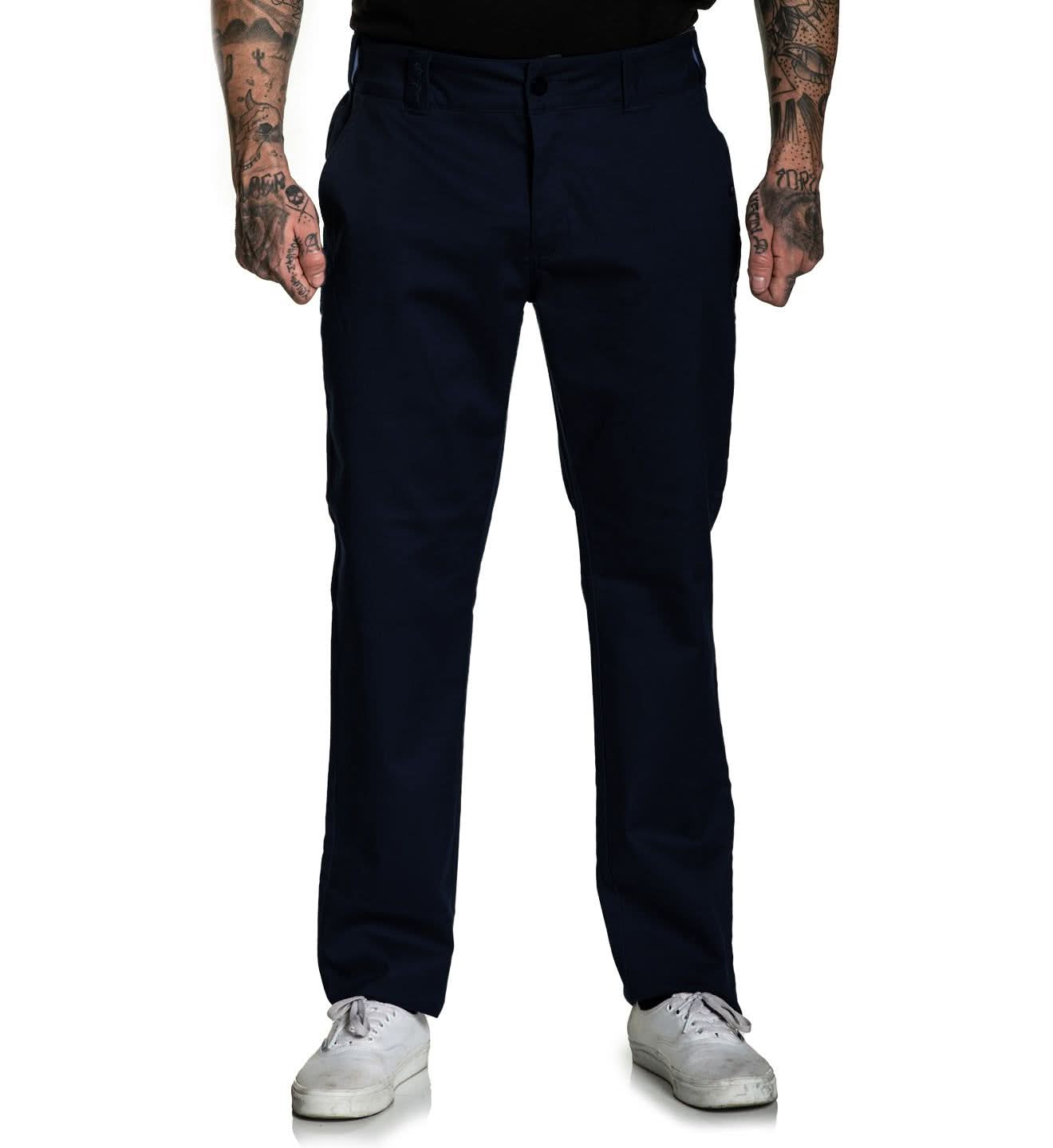 Person wearing navy blue pants on a white background