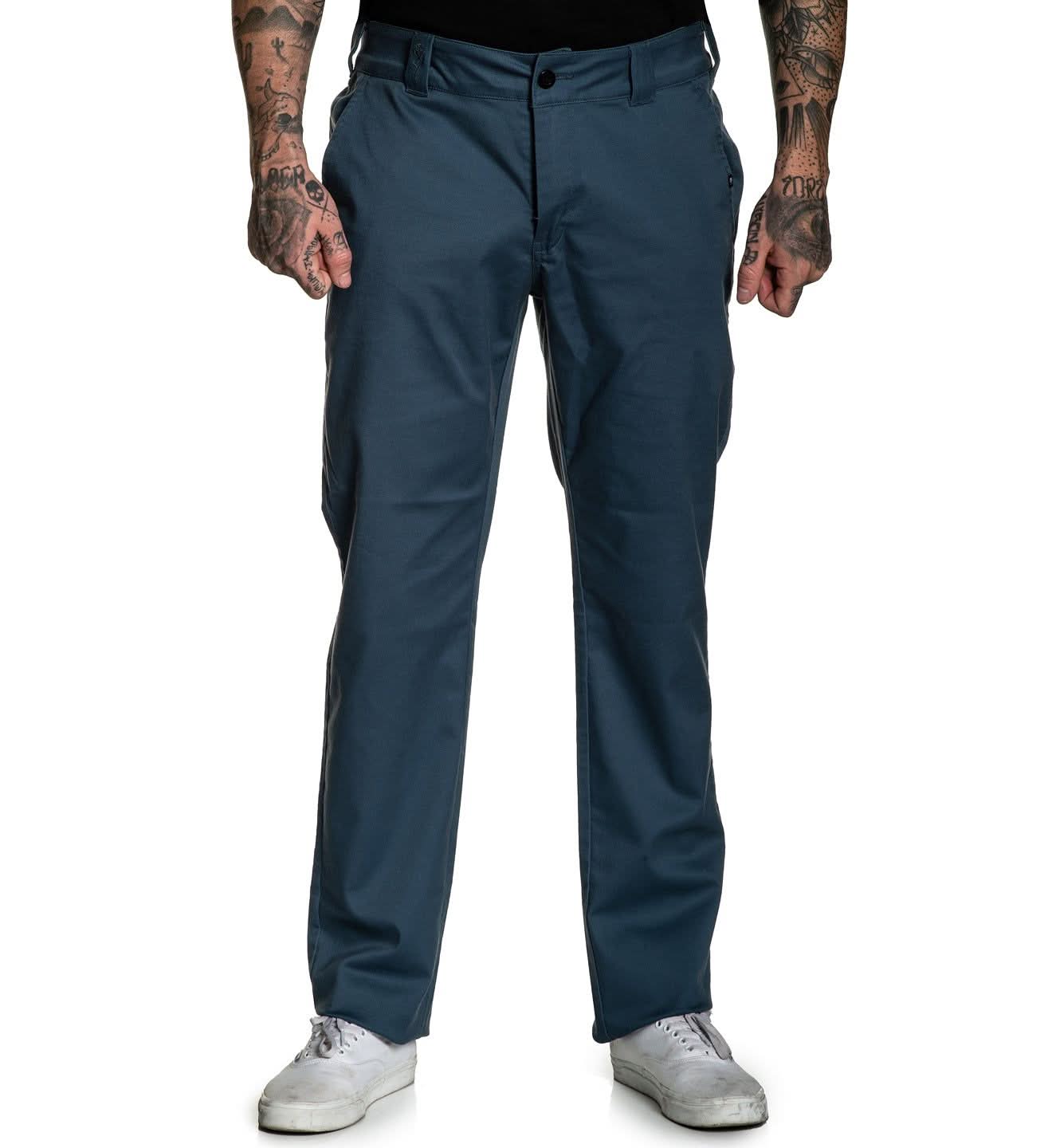 Navy blue pants worn by a person on a white background