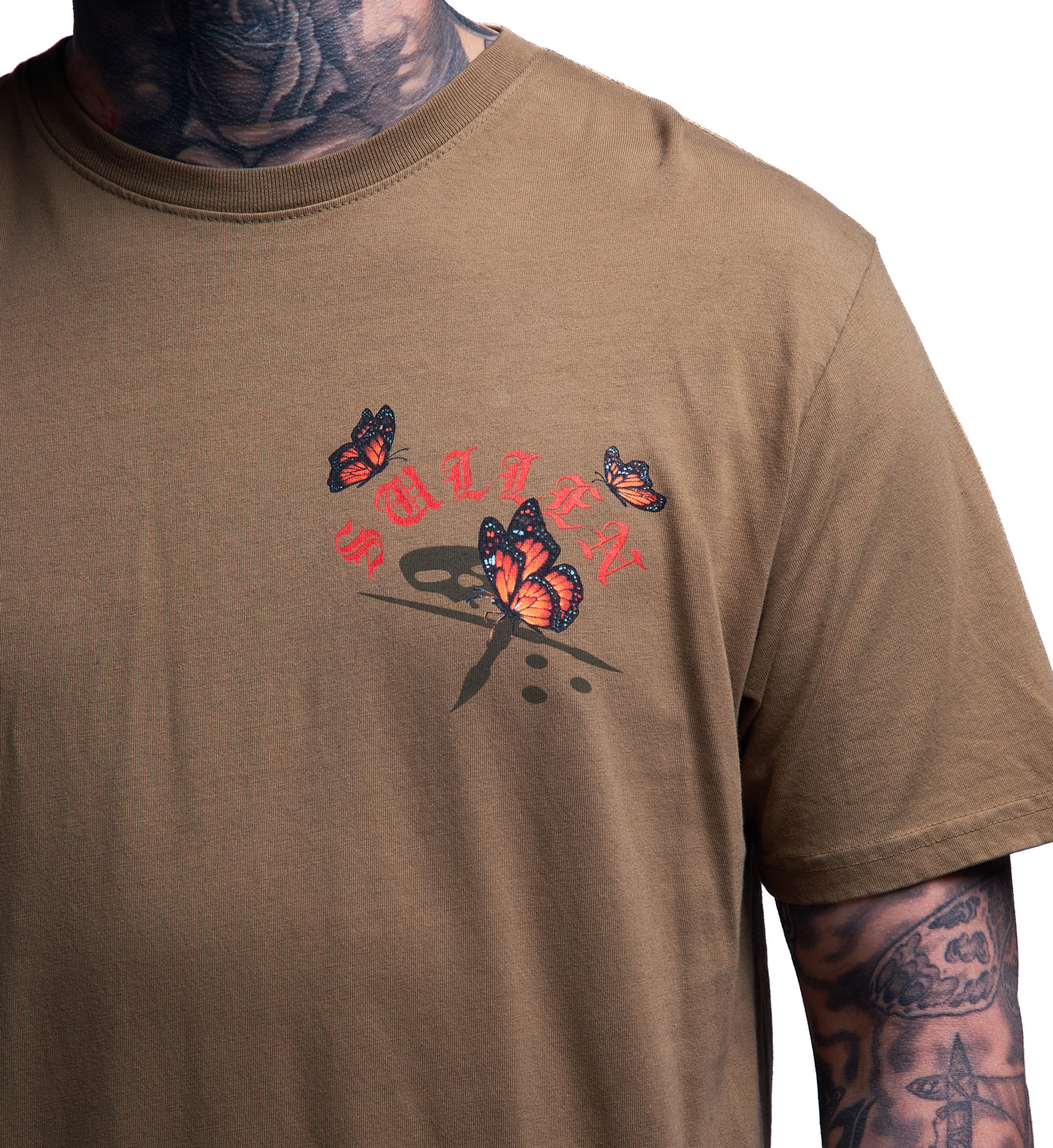 Brown t-shirt with butterfly design and 'Sullen' branding on a white background