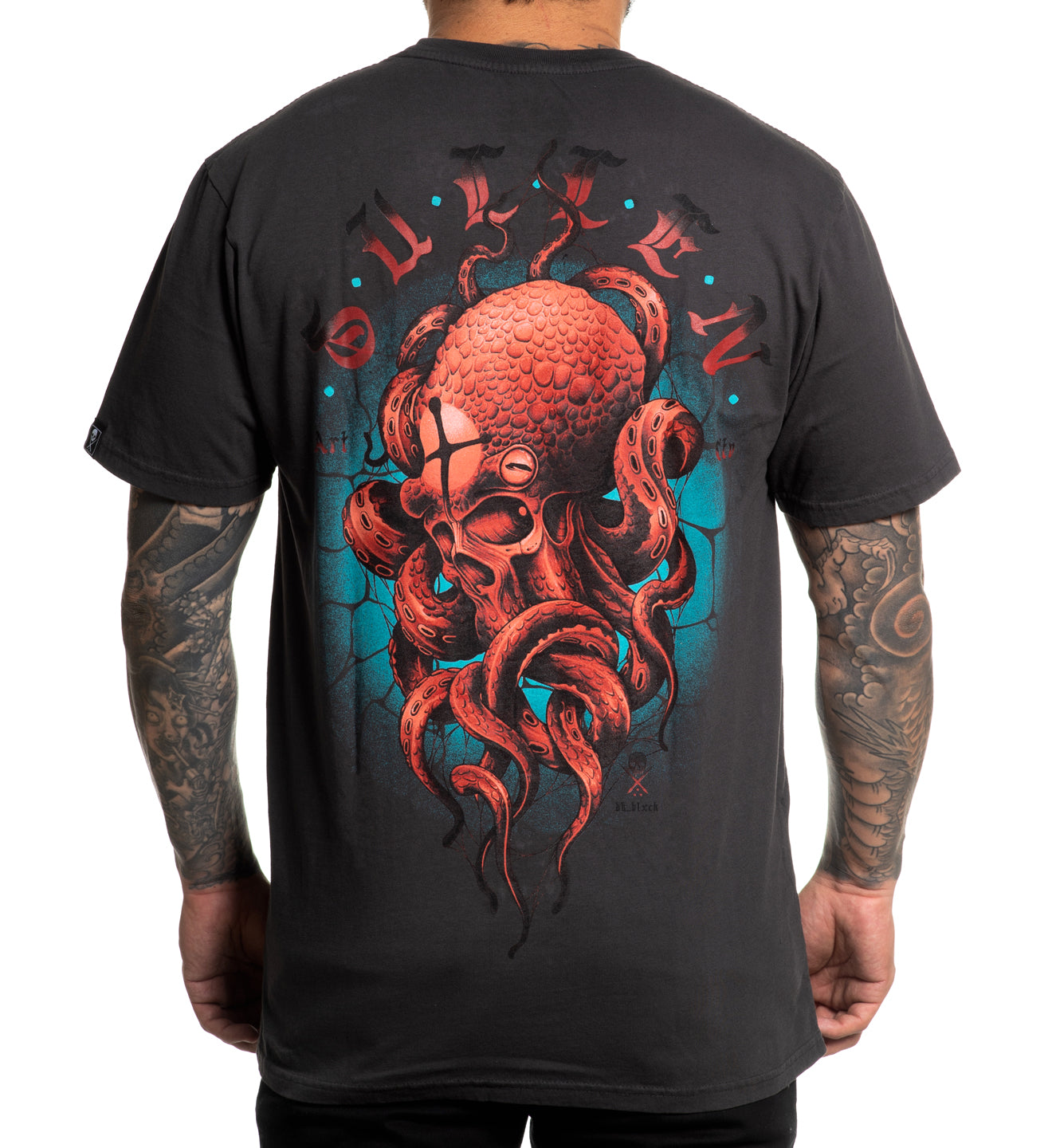 Black t-shirt with a red octopus design on the back, worn by a person.