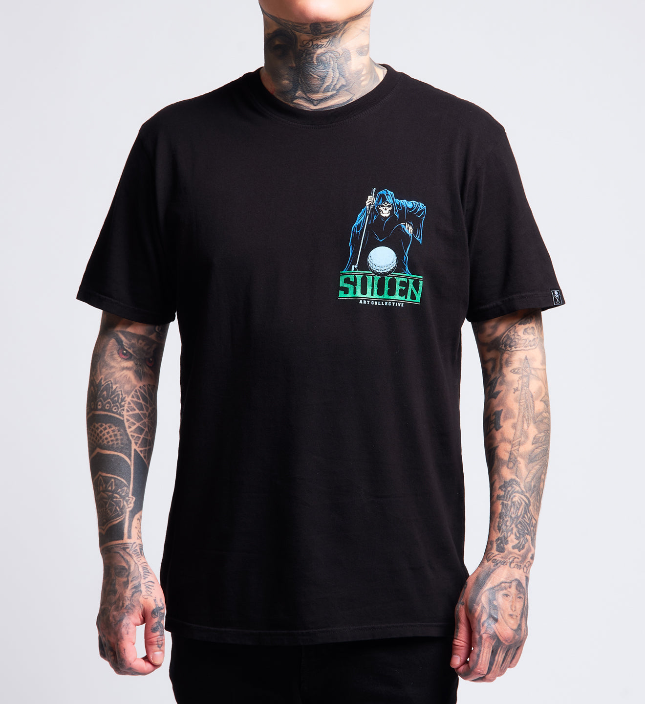 Person wearing a black t-shirt with a graphic design and 'Sullen' branding on a gray background