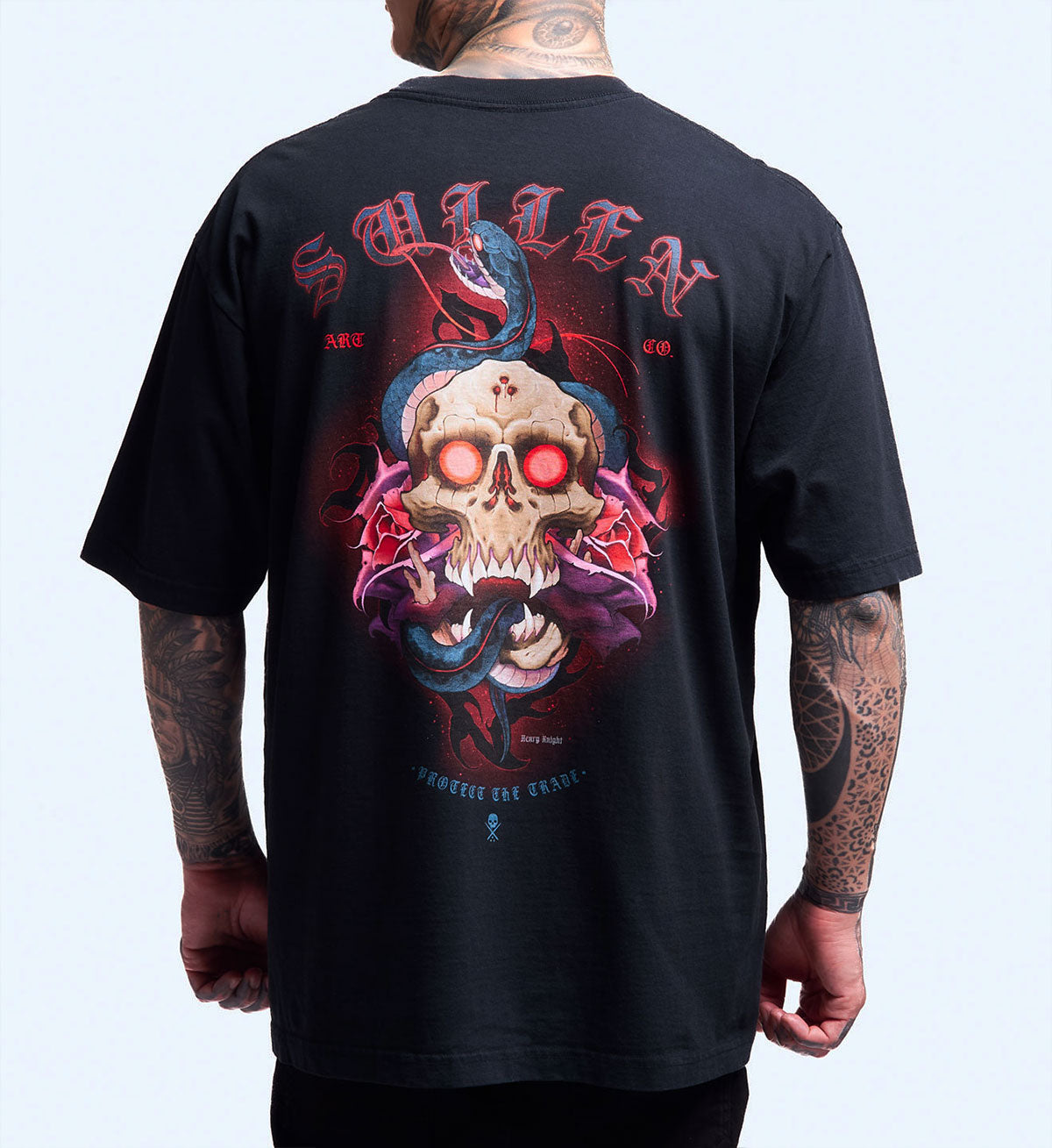 Black t-shirt with a skull and snake design on the back, worn by a person.