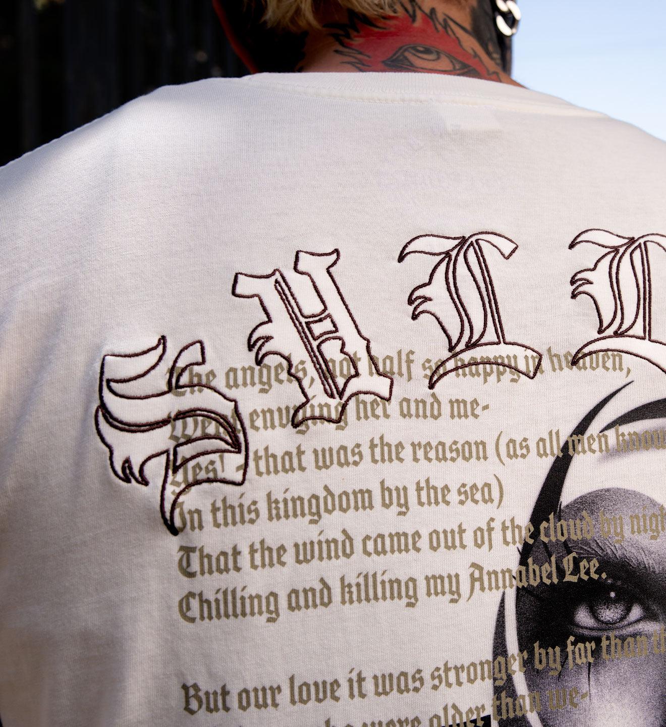Person wearing a shirt with text and symbols on the back