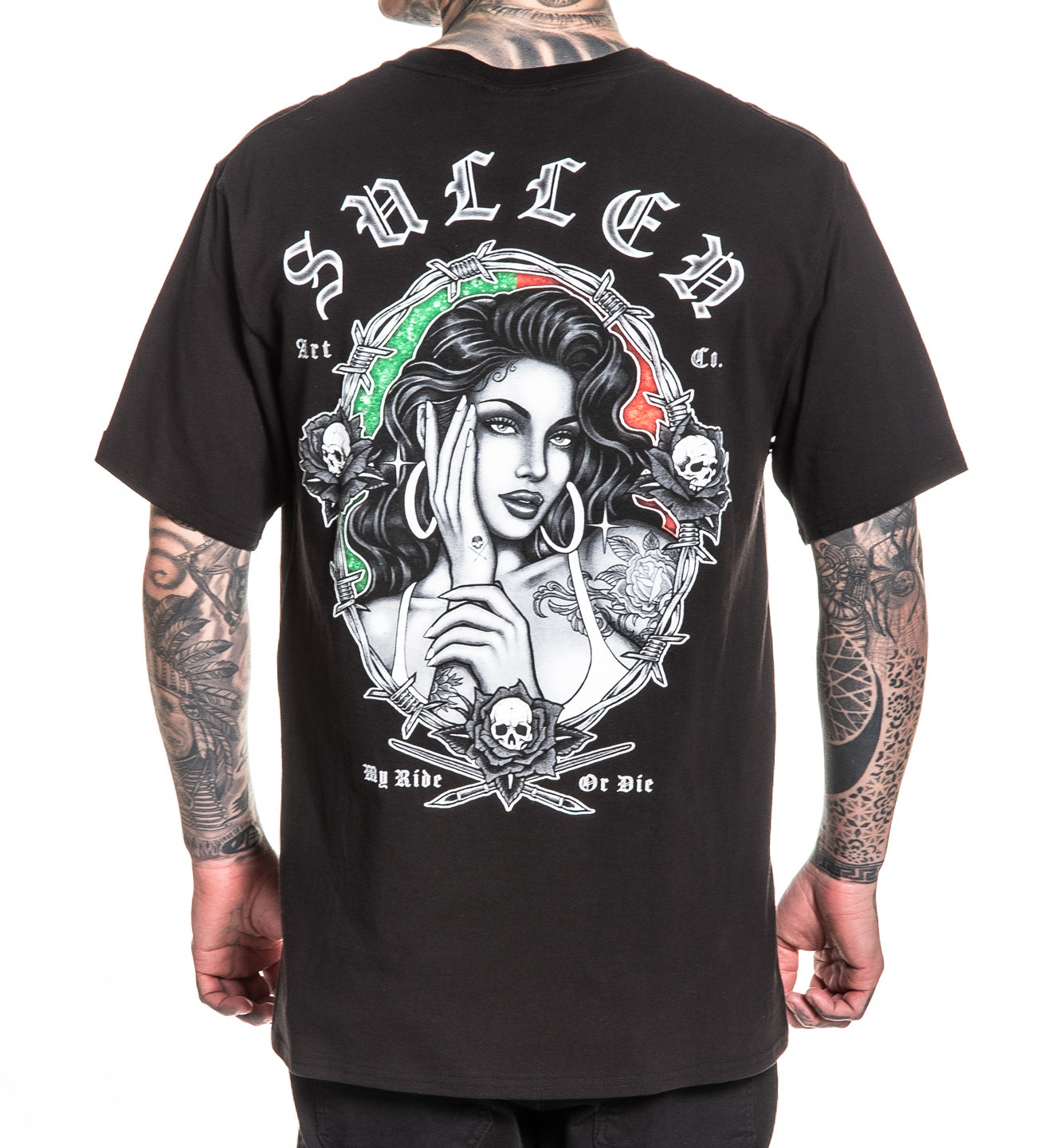 Black t-shirt with a graphic design and 'Sullen' branding on the back, worn by a person with tattoos.