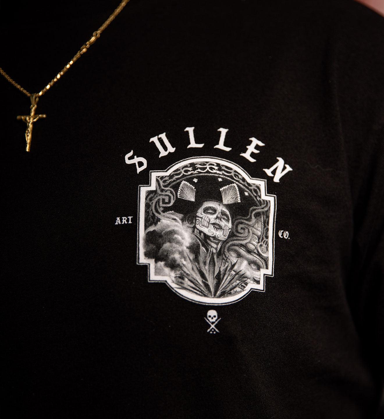 Black t-shirt with 'Sullen' logo featuring a skull and crossbones design.