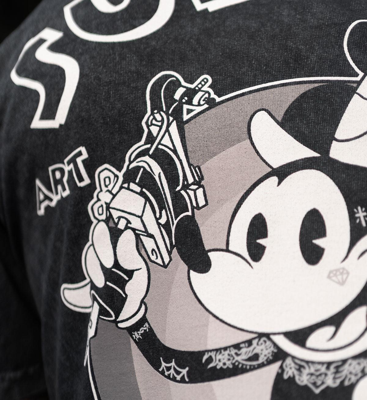 Black t-shirt with a graphic design of a skeleton hand holding a gun and a stylized face.