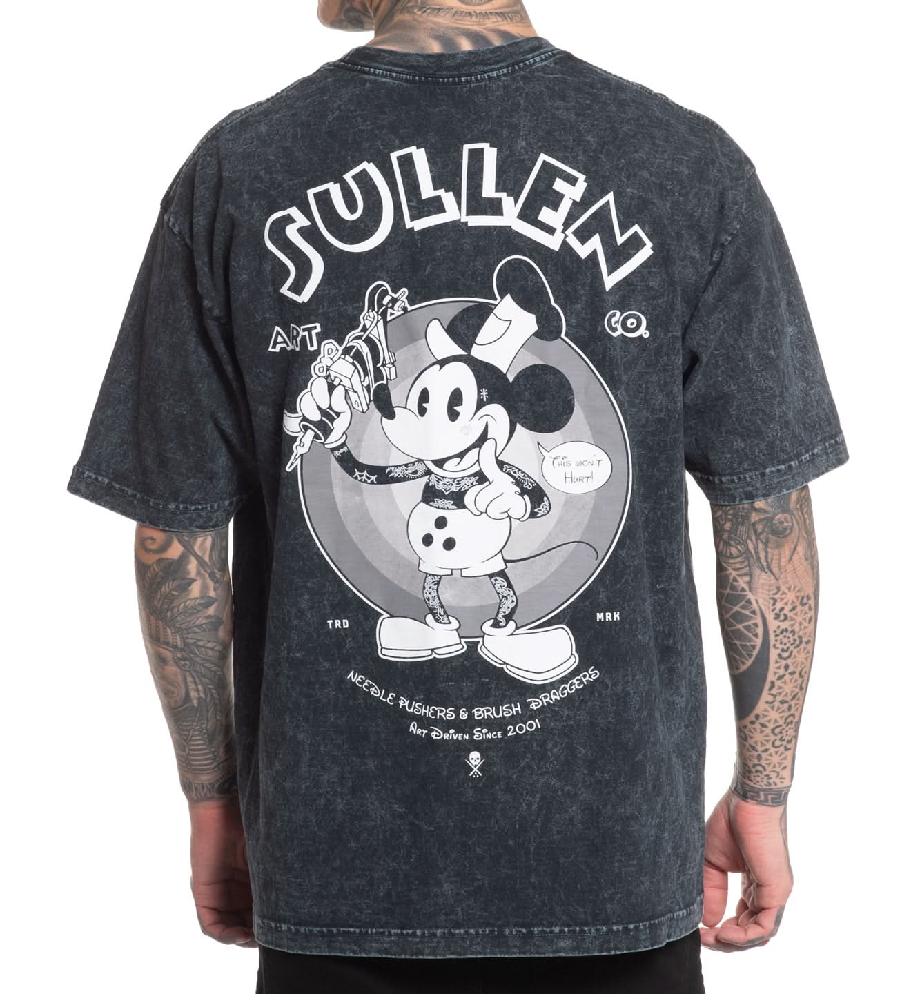 Person wearing a black t-shirt with a graphic design and 'Sullen' branding on the back.