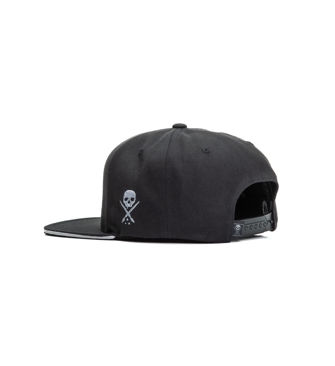 Black cap with skull and crossbones design on a white background
