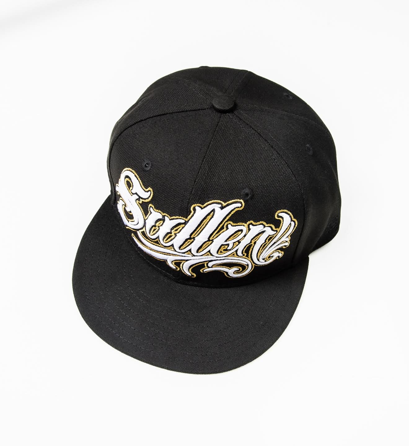 Black cap with gold lettering on a white background