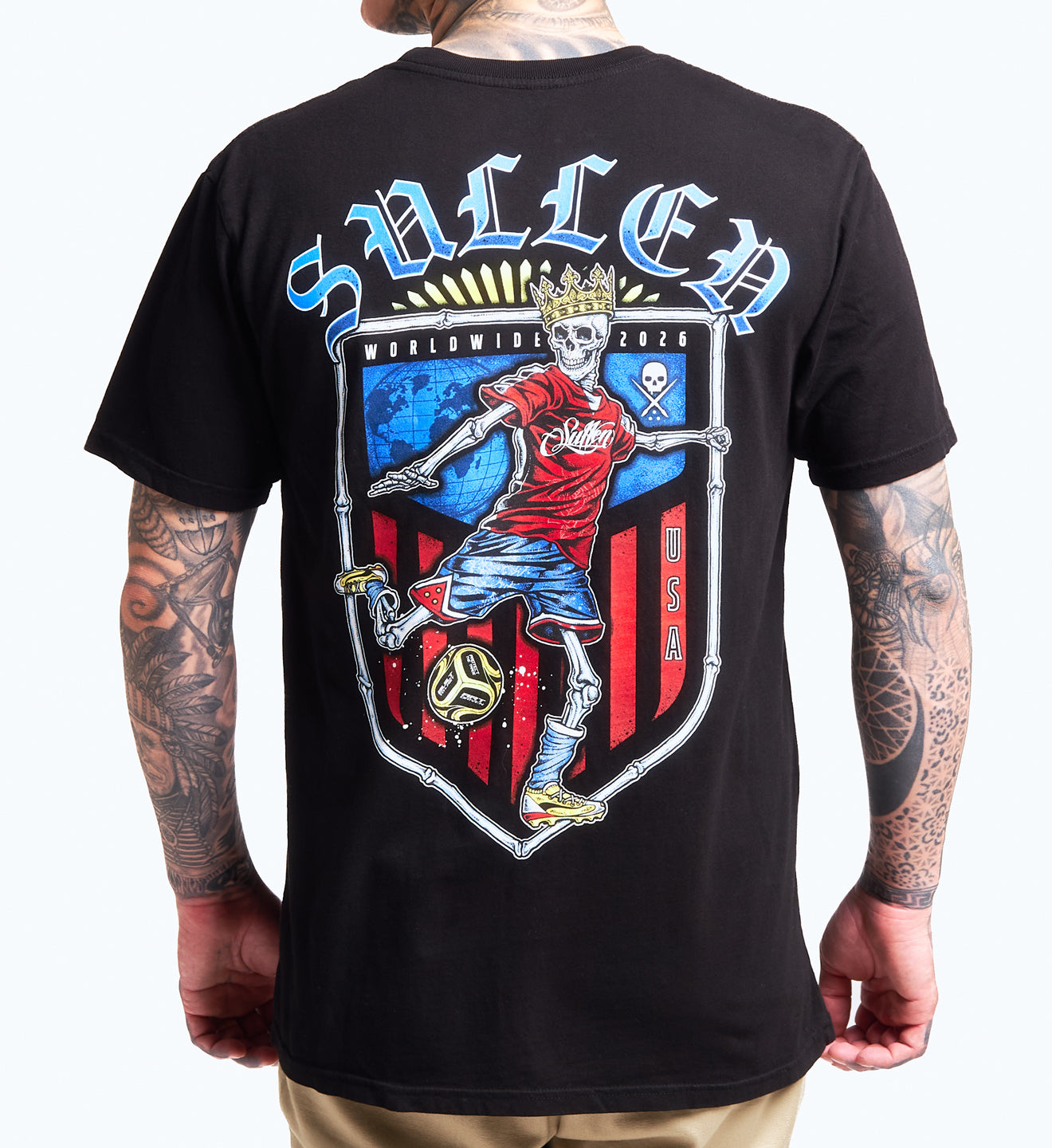 Black t-shirt with a graphic design featuring a skeleton playing soccer, brand name 'Sullen' on the back.