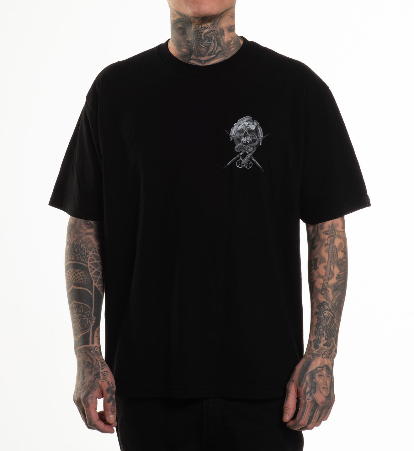 Person wearing a black t-shirt with a graphic design on a white background