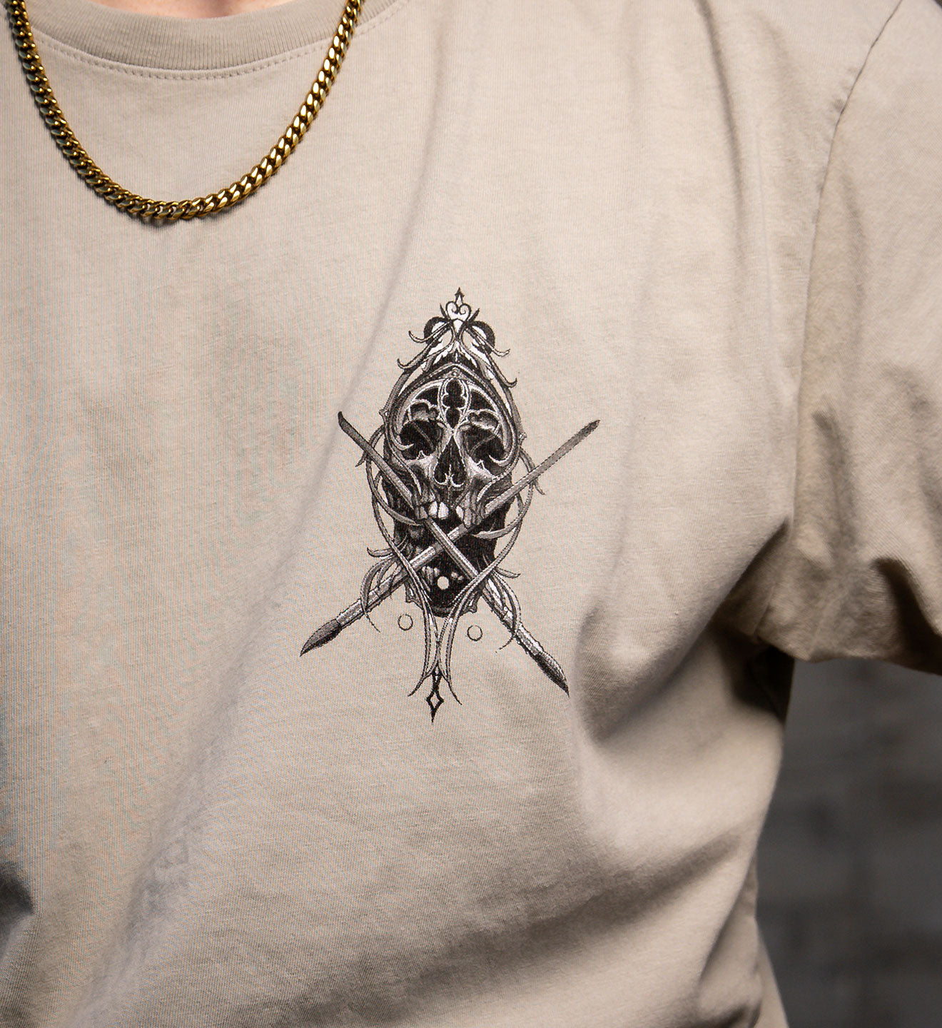 T-shirt with a detailed black and white design on a beige background