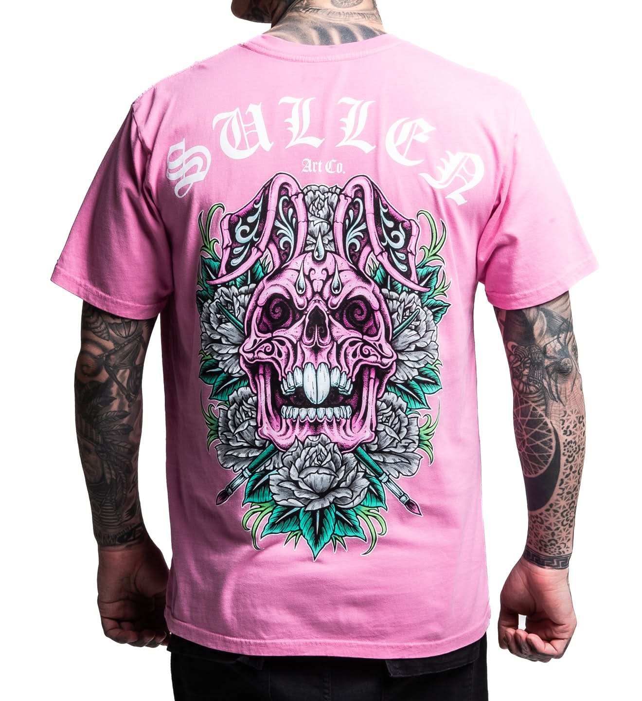 Pink t-shirt with a graphic design of a pink skull and tattoos on a white background