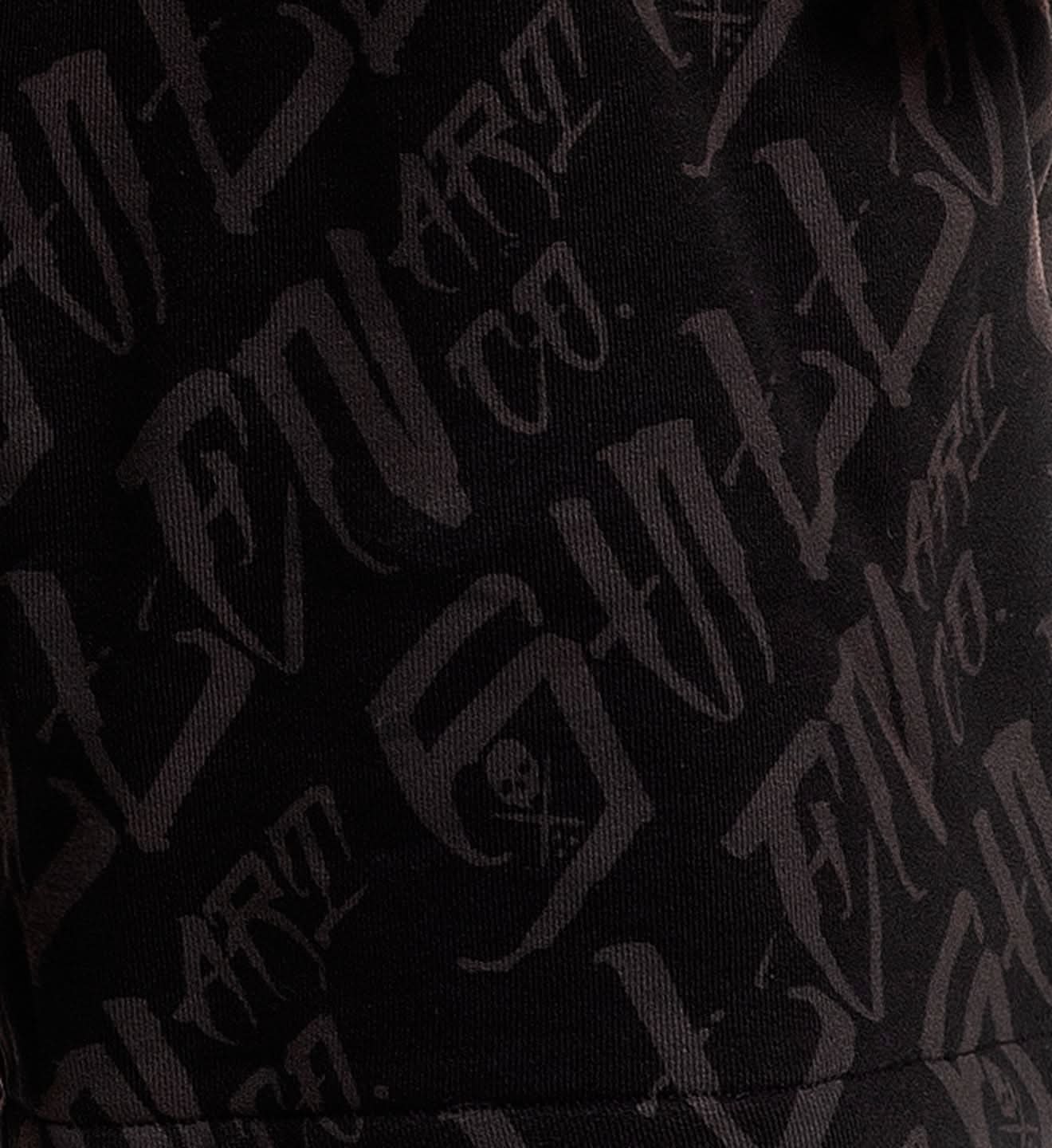 Close-up of a black fabric with 'G/FORE' branding.