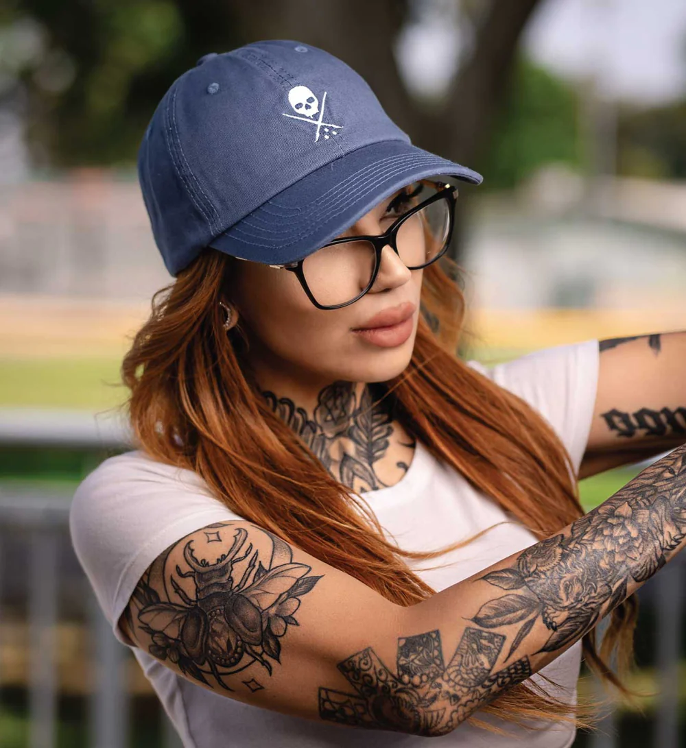 Tattoo model wearing the Pop Badge Hat from Sullen