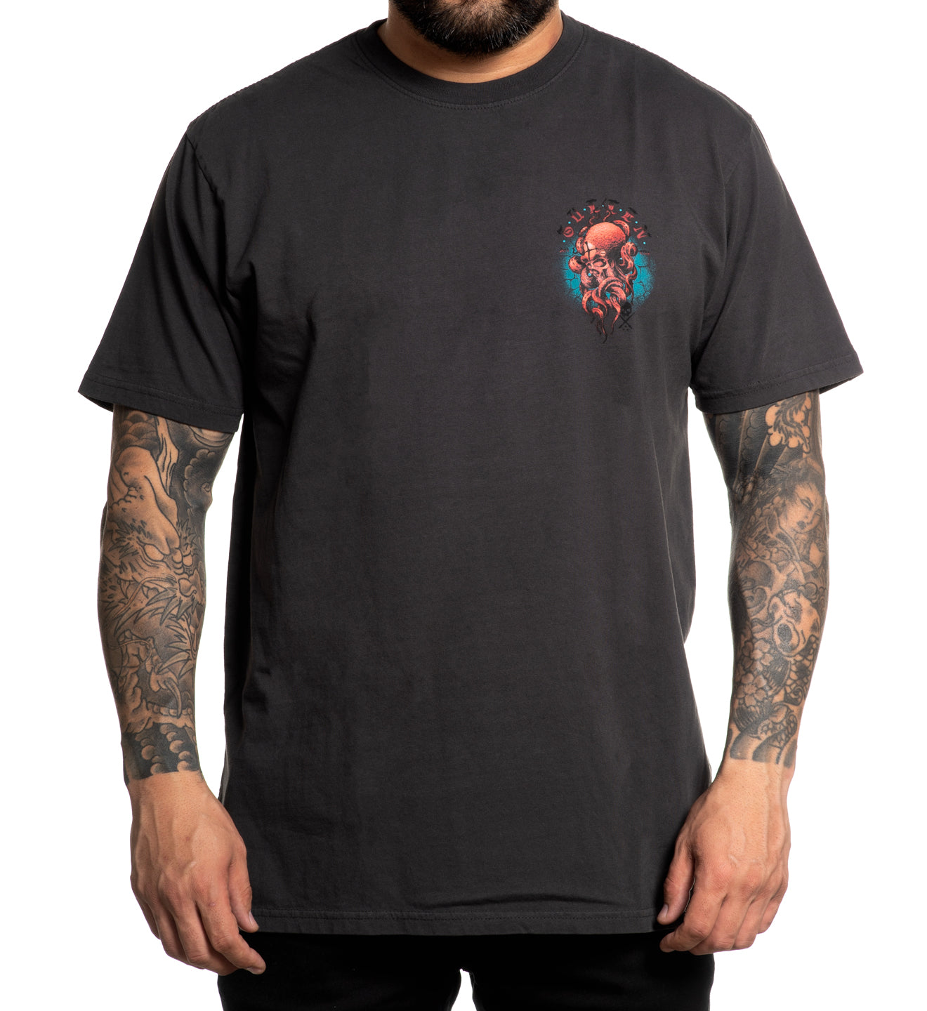 Person wearing a black t-shirt with a graphic design on a white background