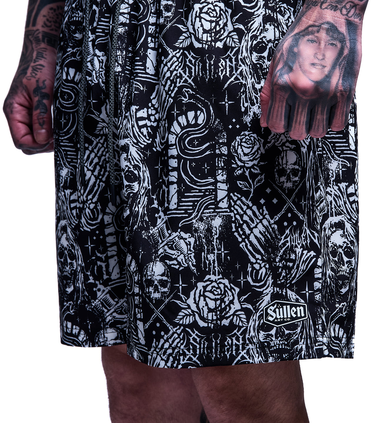 Black and white patterned shorts with visible brand logo on a plain background