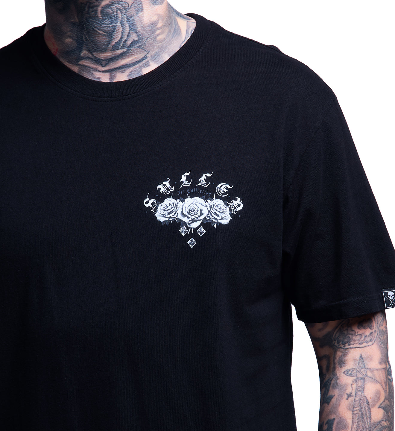 Black t-shirt with white rose design on a plain background