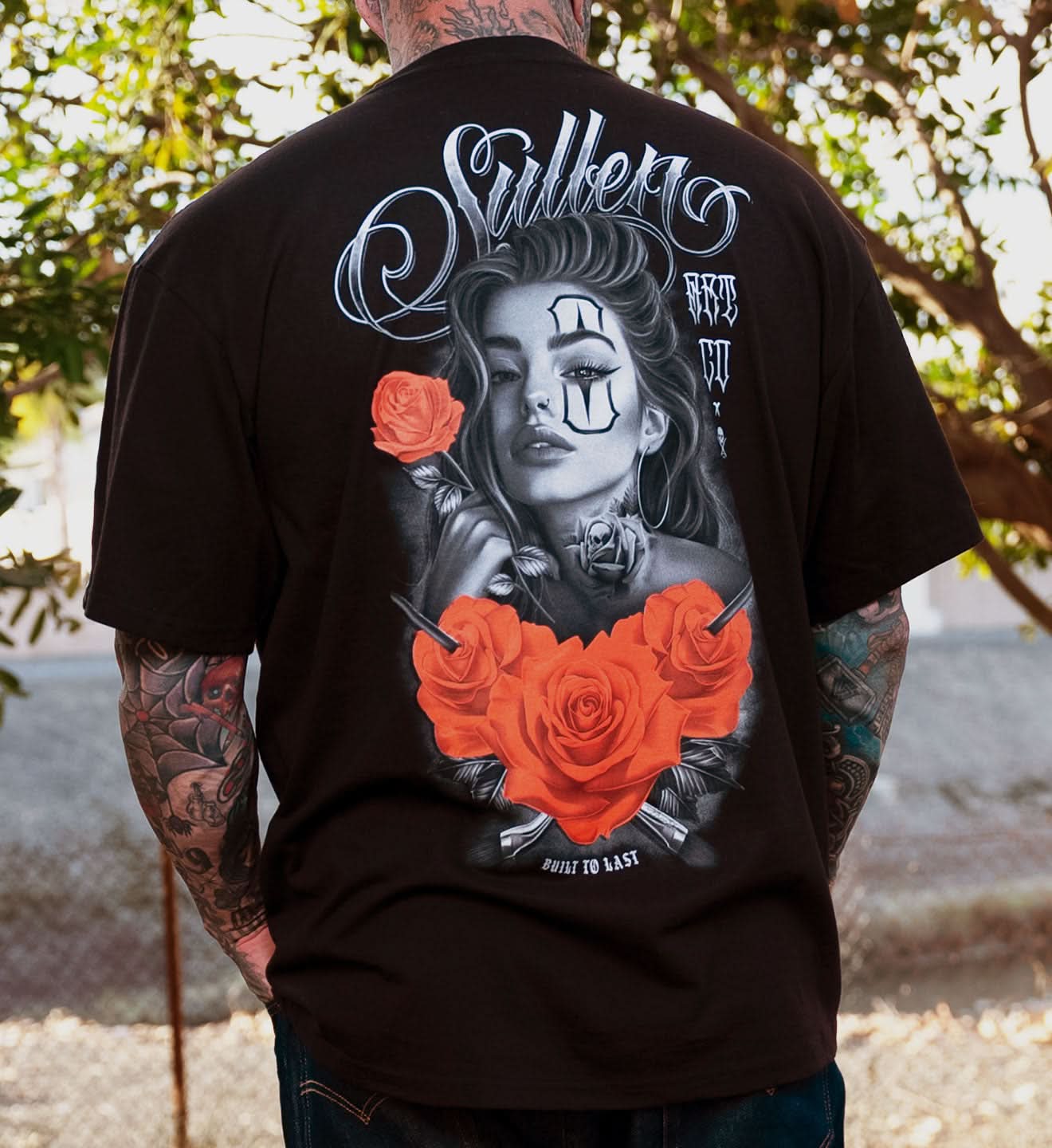 BLACK SULLEN T SHIRT WITH A WOMAN HOLDING A ROSE