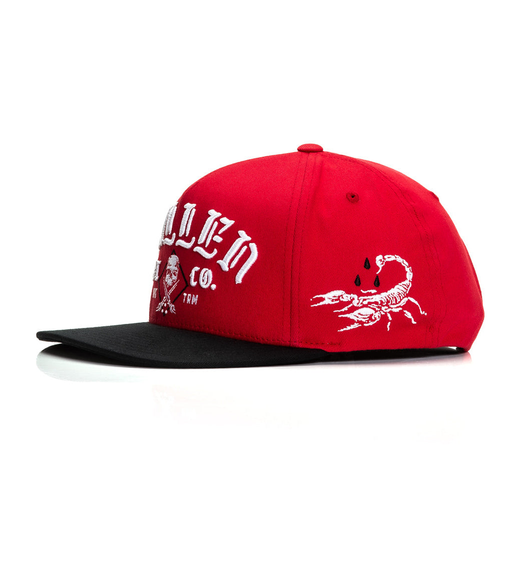 Red cap with white text and logo on a white background