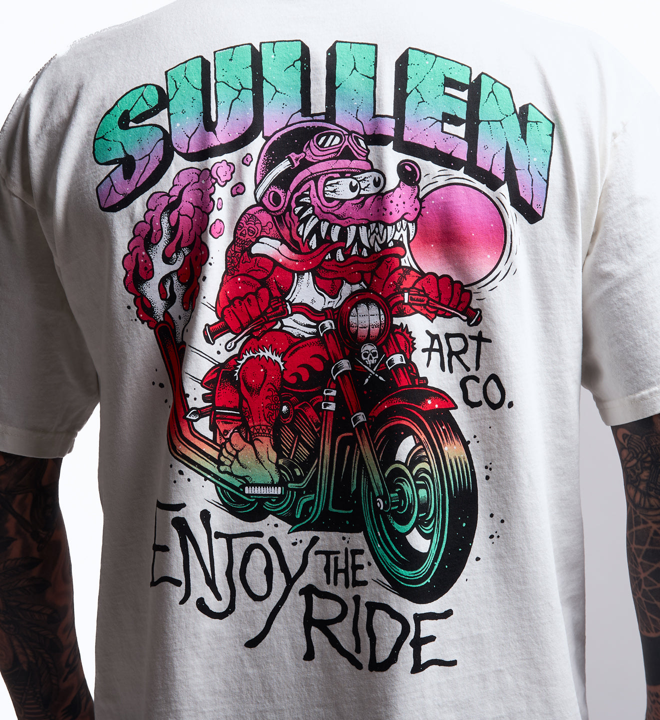 White t-shirt with colorful graphic design and 'Sullen Art Co.' text on a person wearing it.