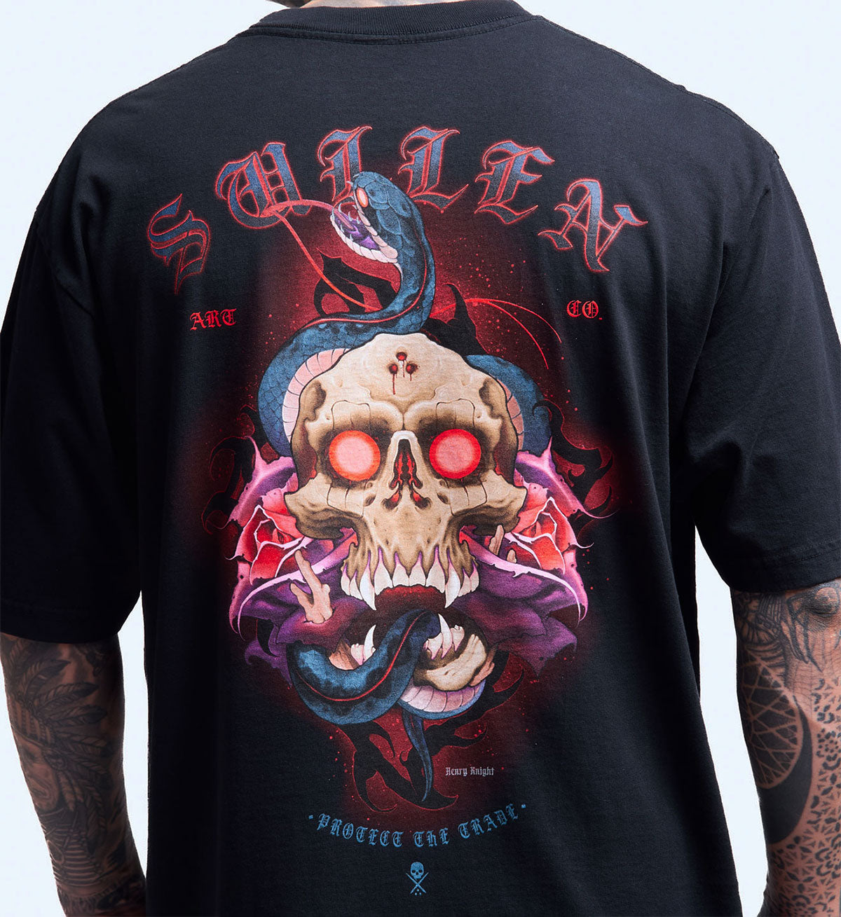 Black t-shirt with a colorful skull design on the back, featuring red eyes and intricate details.