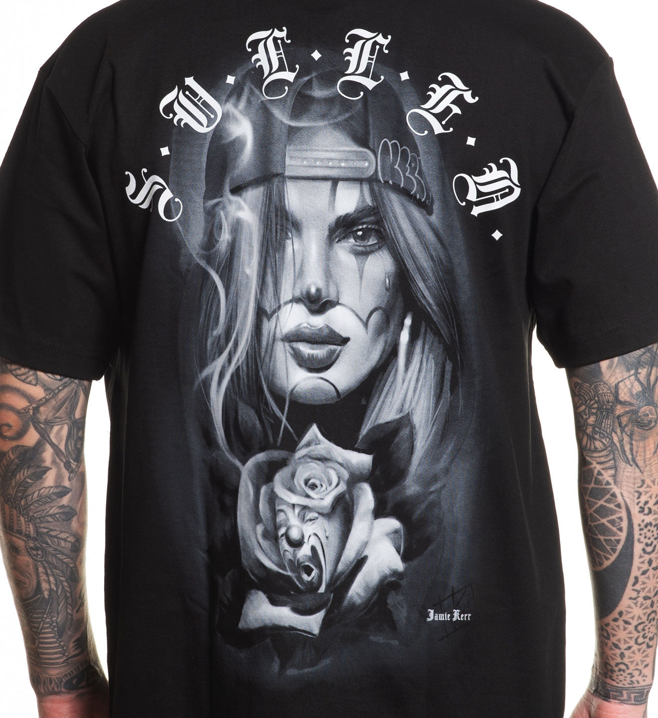 Black t-shirt with a graphic design of a woman's face and tattoos, worn by a person.