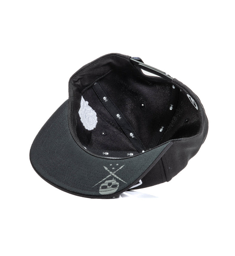 Black cap with white patterns on a white background