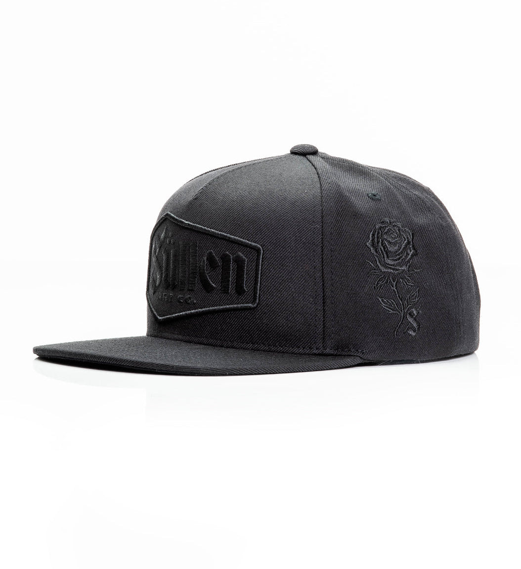 Black trucker cap with skull and crossbones design on a white background