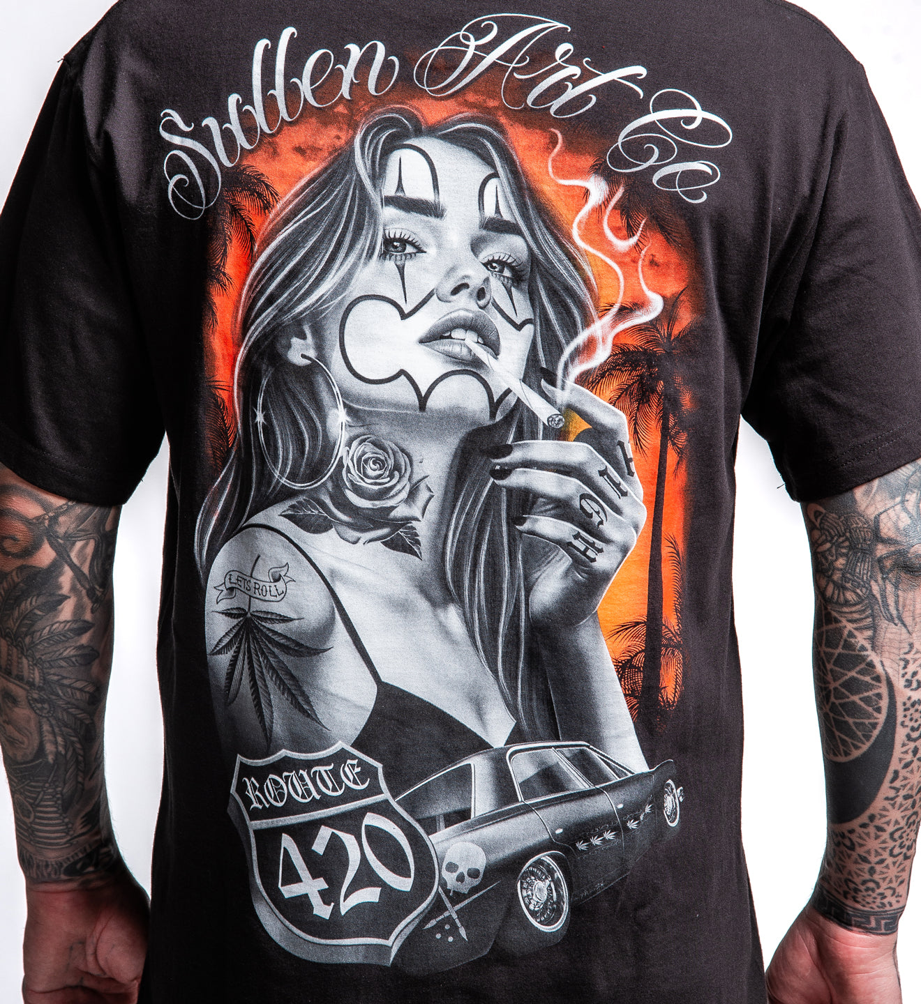 Black t-shirt with a graphic design of a woman smoking, Route 420, and 'Stolen Art Co' text.