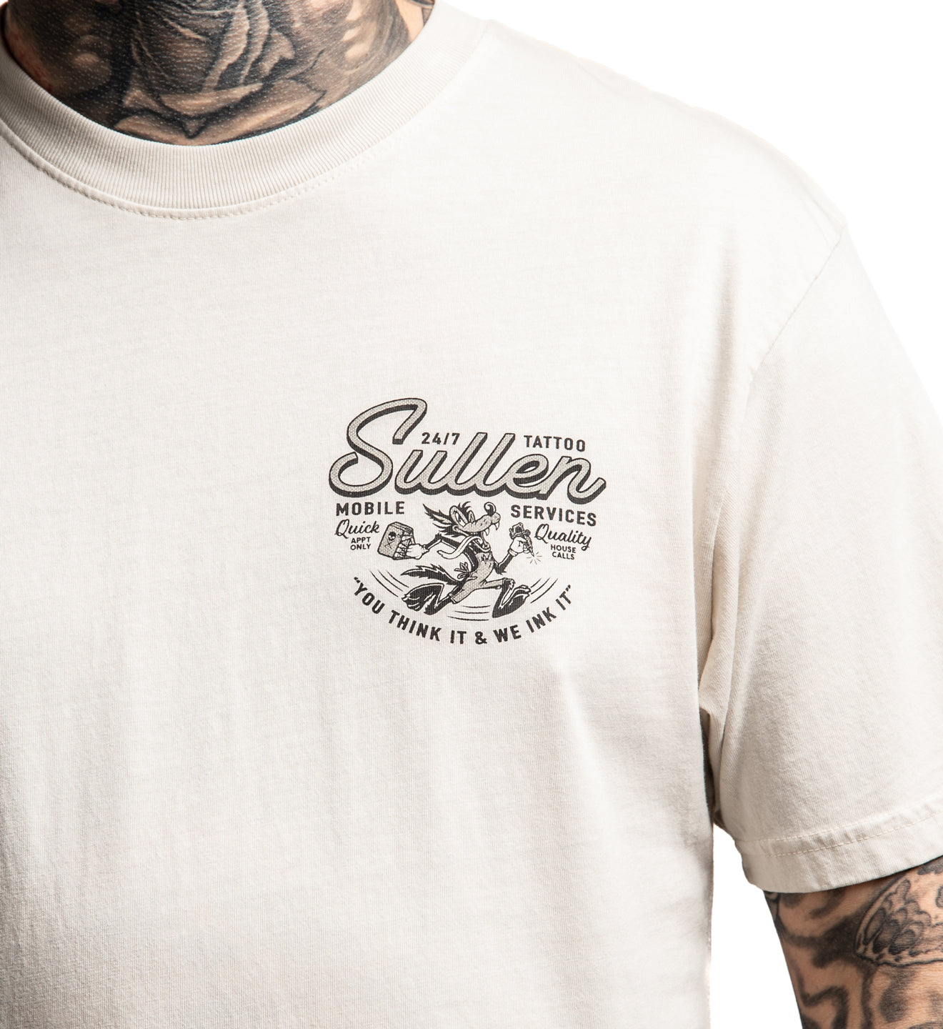 White t-shirt with a tattoo-themed graphic design on a person wearing tattoos.