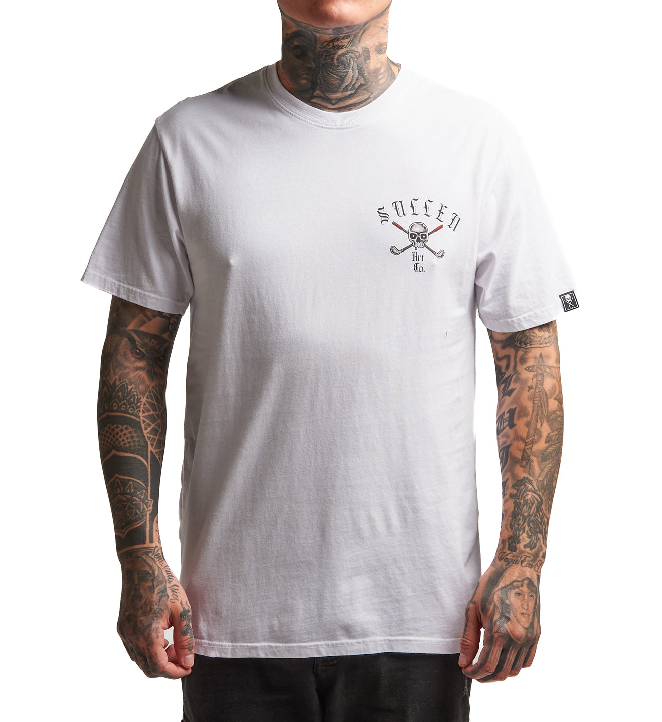 Person wearing a white t-shirt with a logo on a plain background
