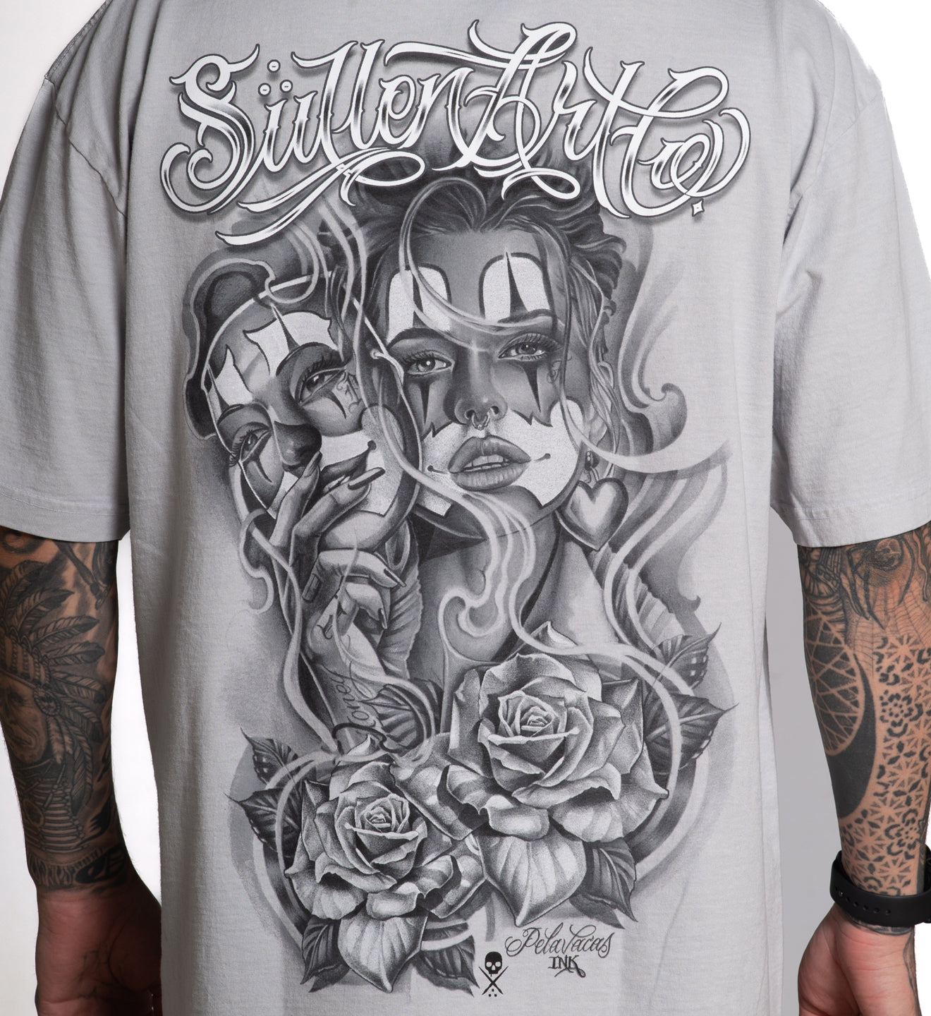 Gray t-shirt with a black and white graphic design of a woman's face, roses, and text on a plain background.