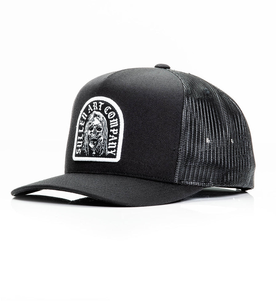 Black trucker cap with a logo on the front panel against a white background
