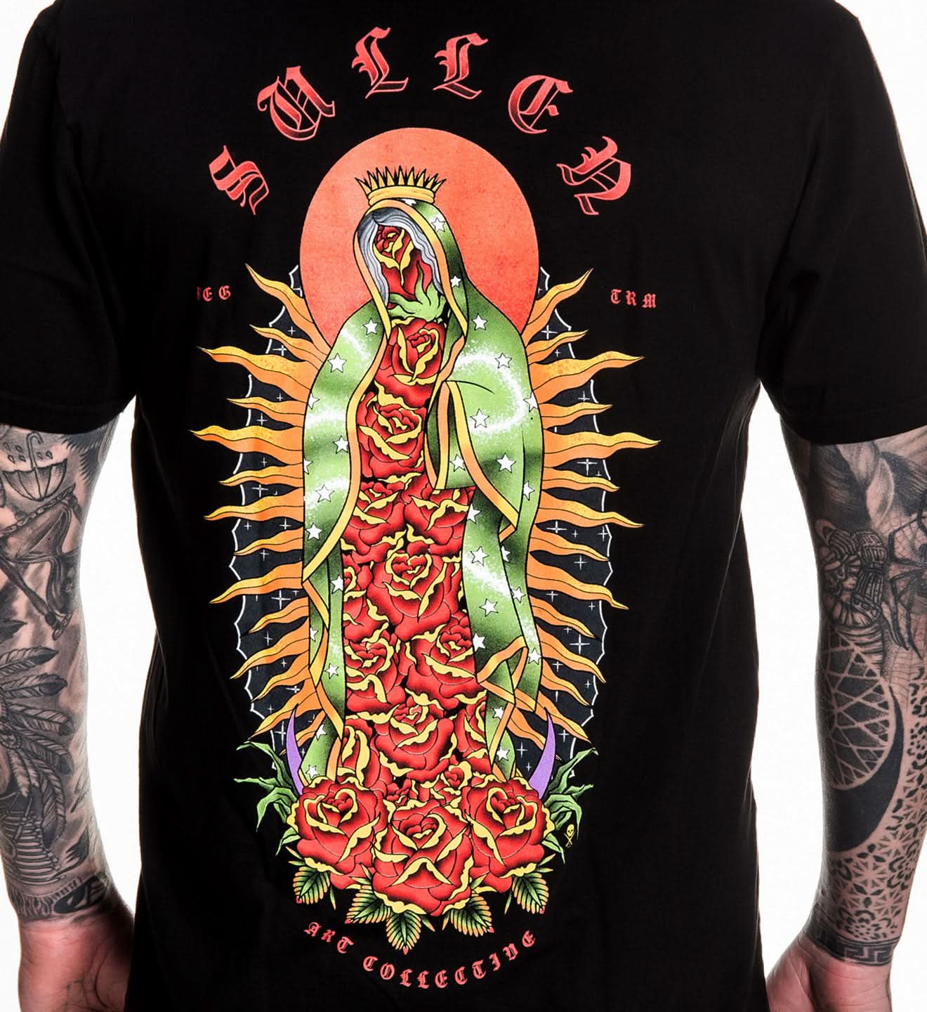 Black t-shirt with colorful graphic design of a religious figure and roses on a white background