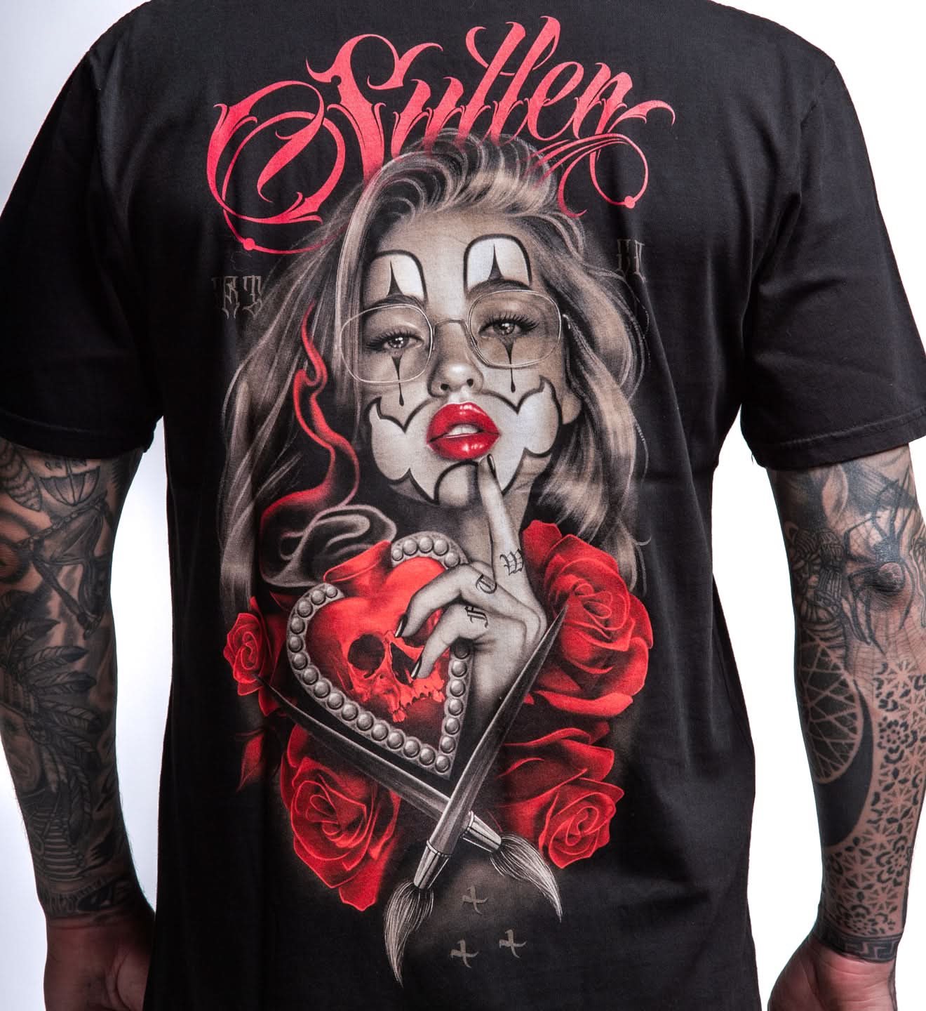 BLACK SULLEN T SHIRT WITH PORTRAIT OF WOMAN WEARING CHICANA MAKEUP AND A HUSH QUIET GESTURE