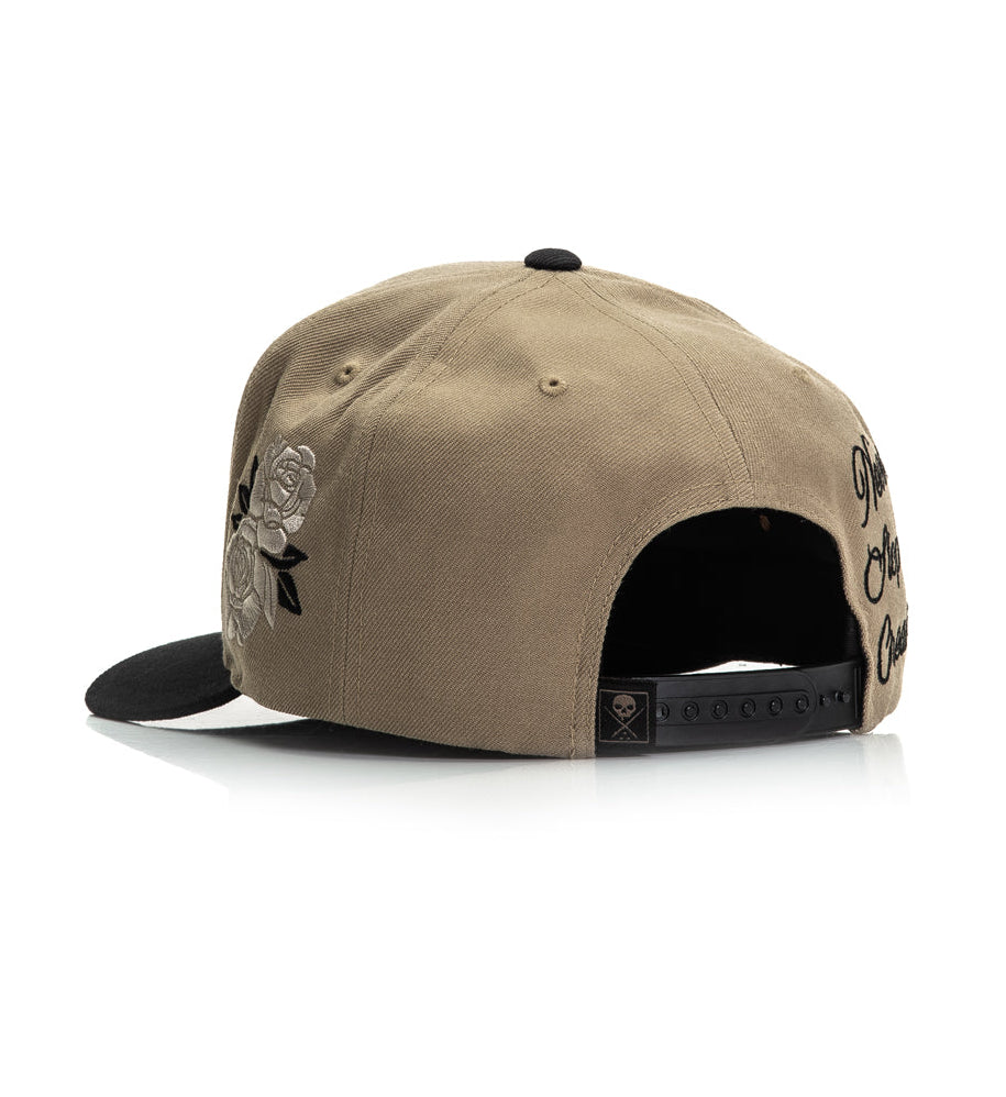 Beige cap with black accents on a white background