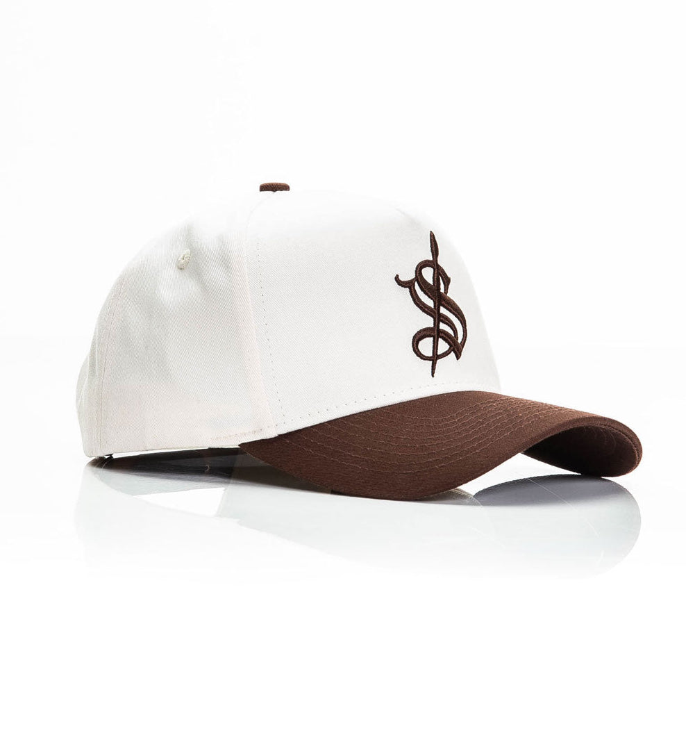 White and brown cap with a logo on a white background