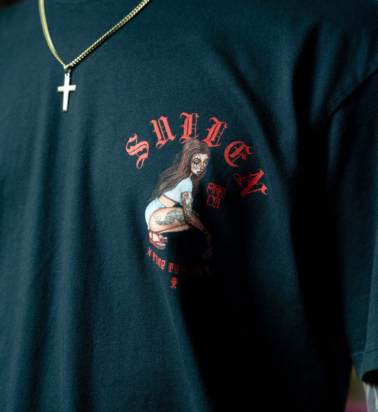 Black t-shirt with graphic design and 'Sullen' branding on a dark background