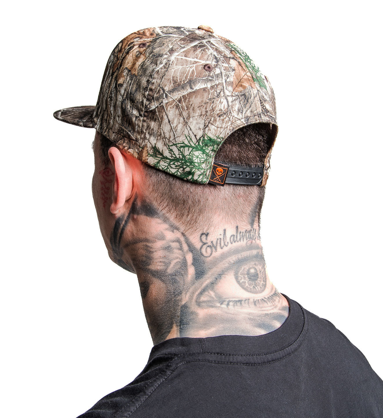 Person wearing a camouflage cap on a white background