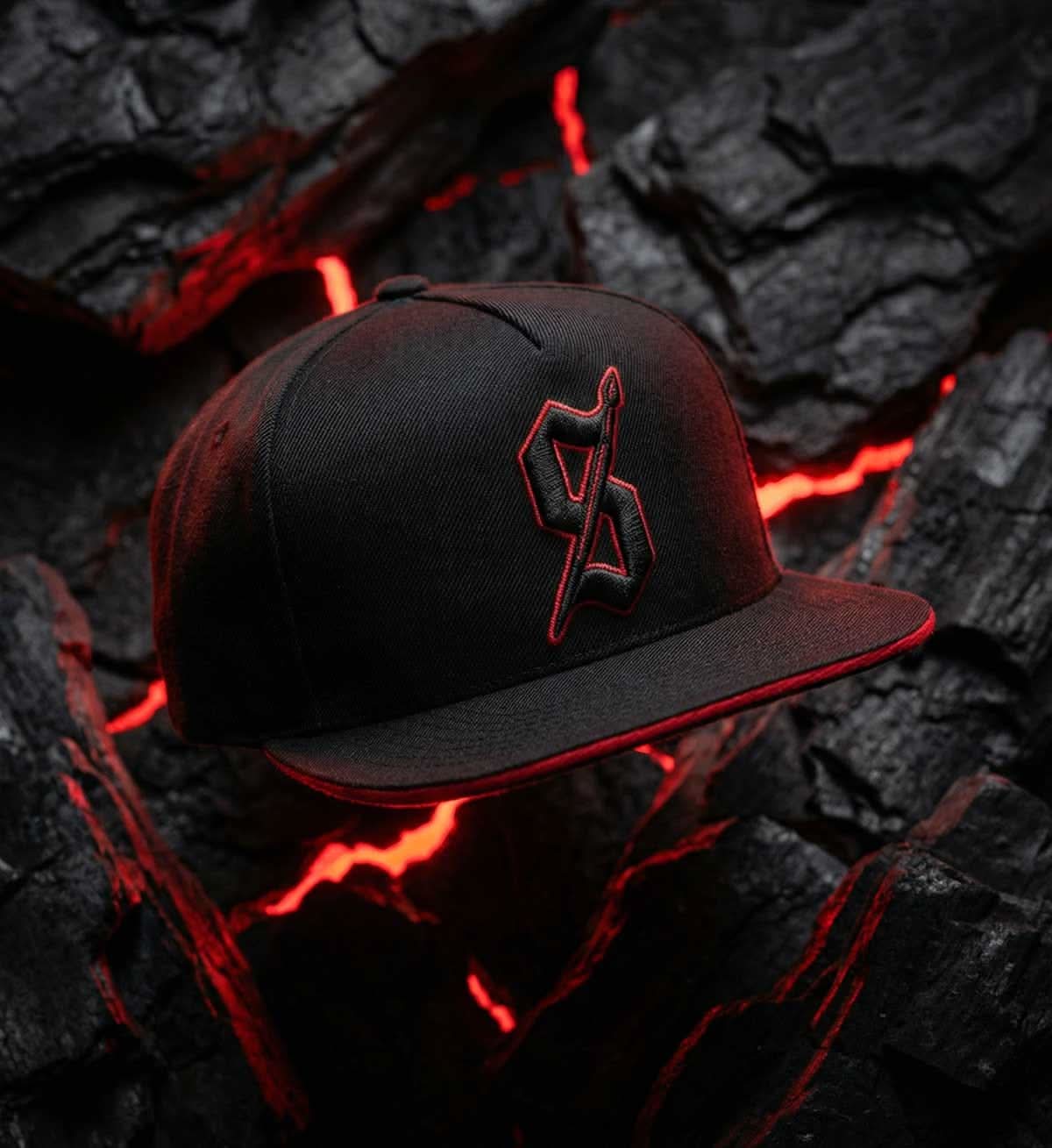 Black cap with red logo on a dark, textured background