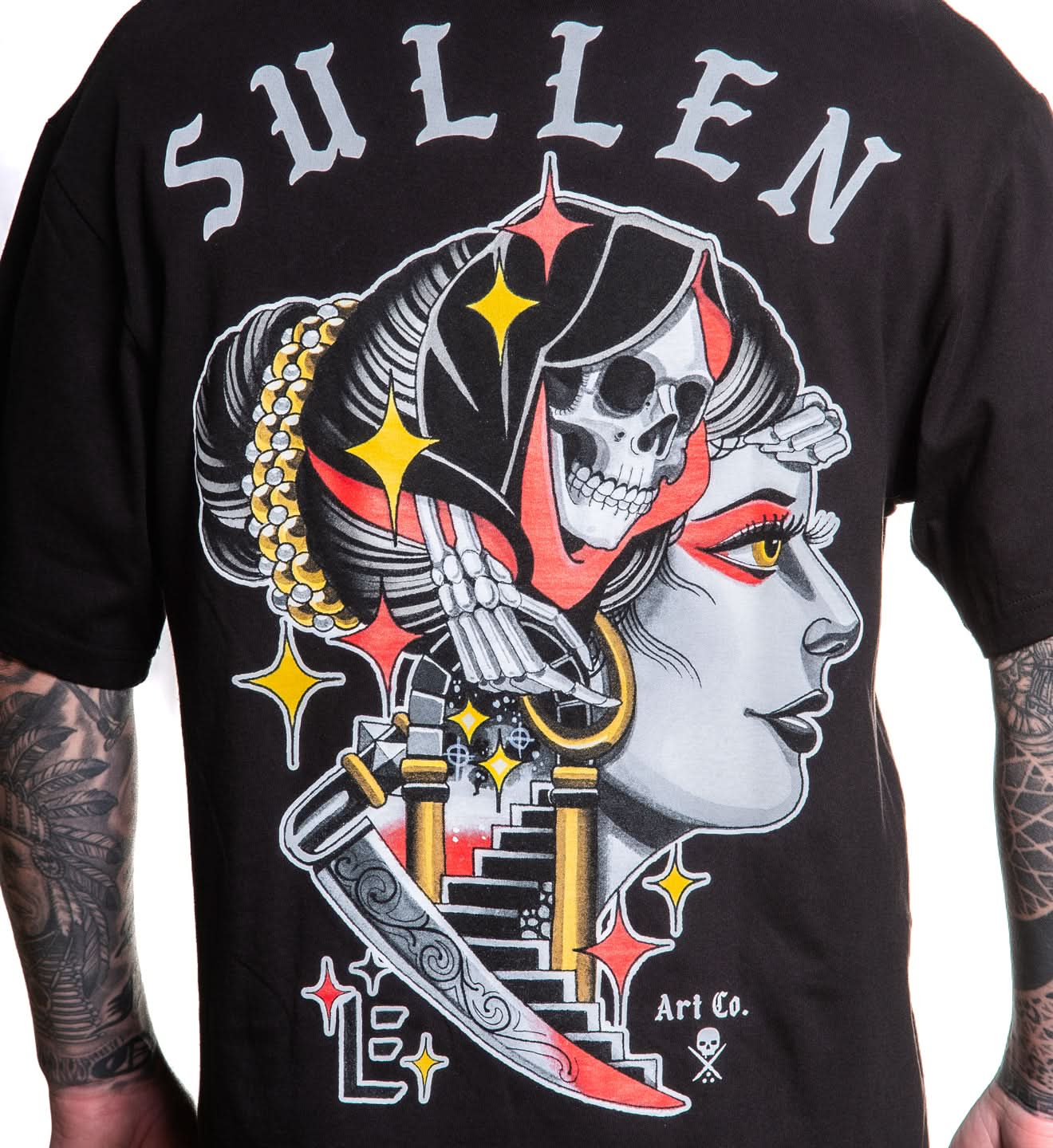 Black t-shirt with a graphic design featuring a skull and woman's face, branded 'Sullen'.