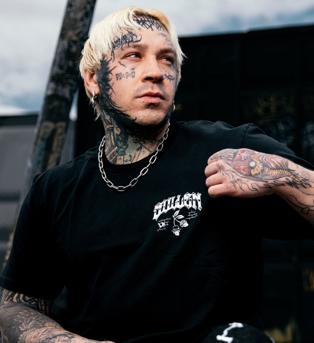 man in a black tee with a white print on the front