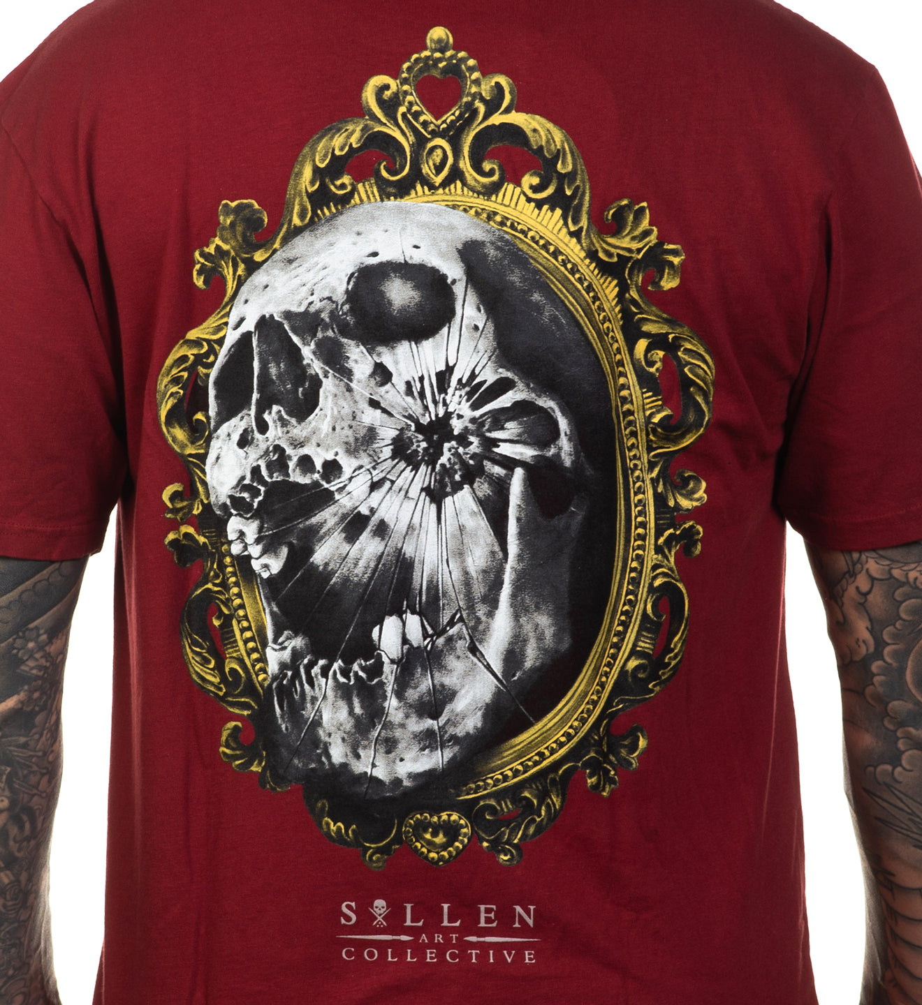Red t-shirt with a skull design and ornate frame on the back, featuring the Sullen Art Collective logo.