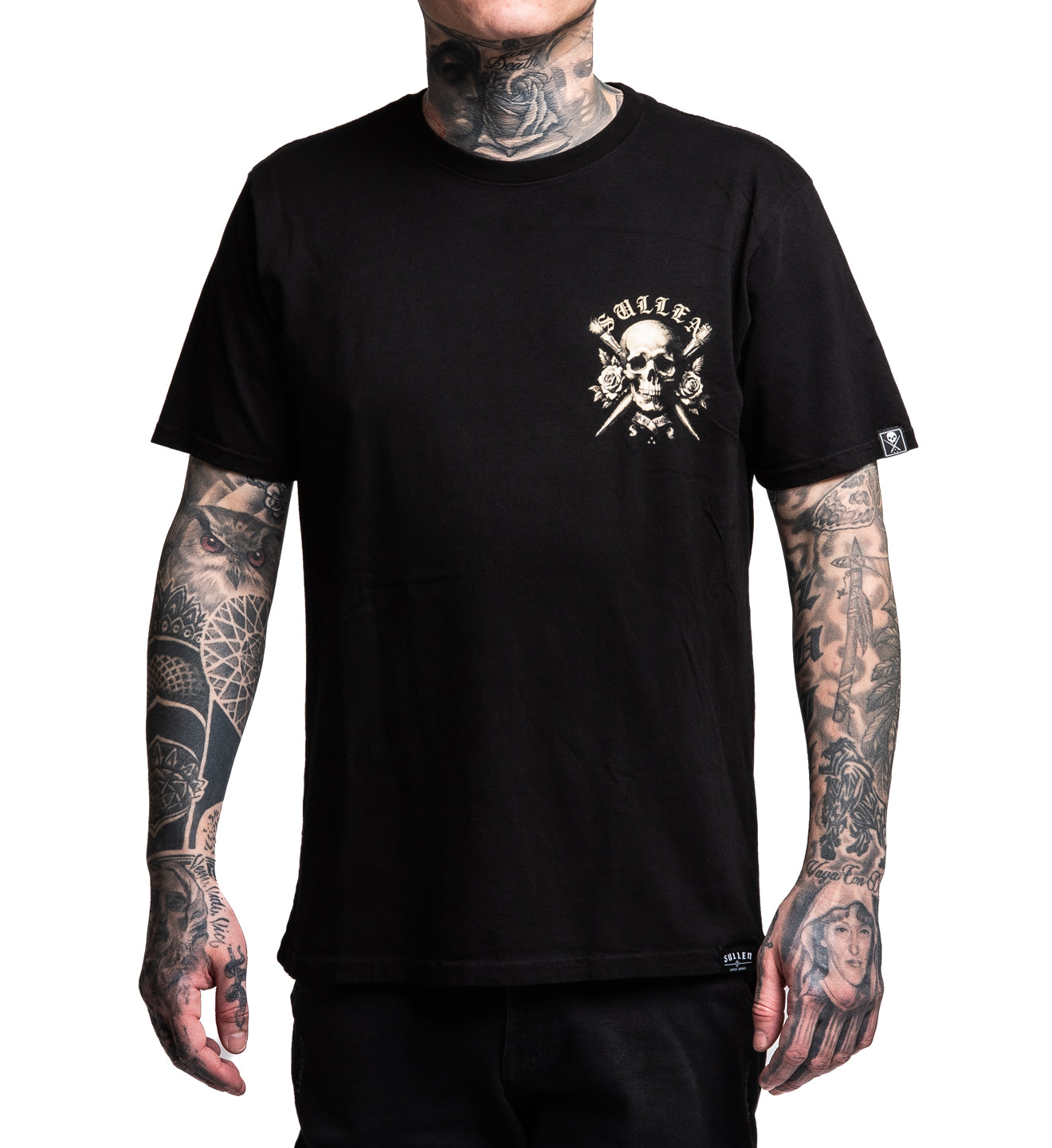 Person wearing a black t-shirt with a skull and roses design on a white background
