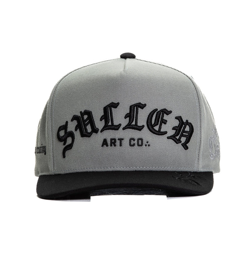 Gray cap with black text on a white background
