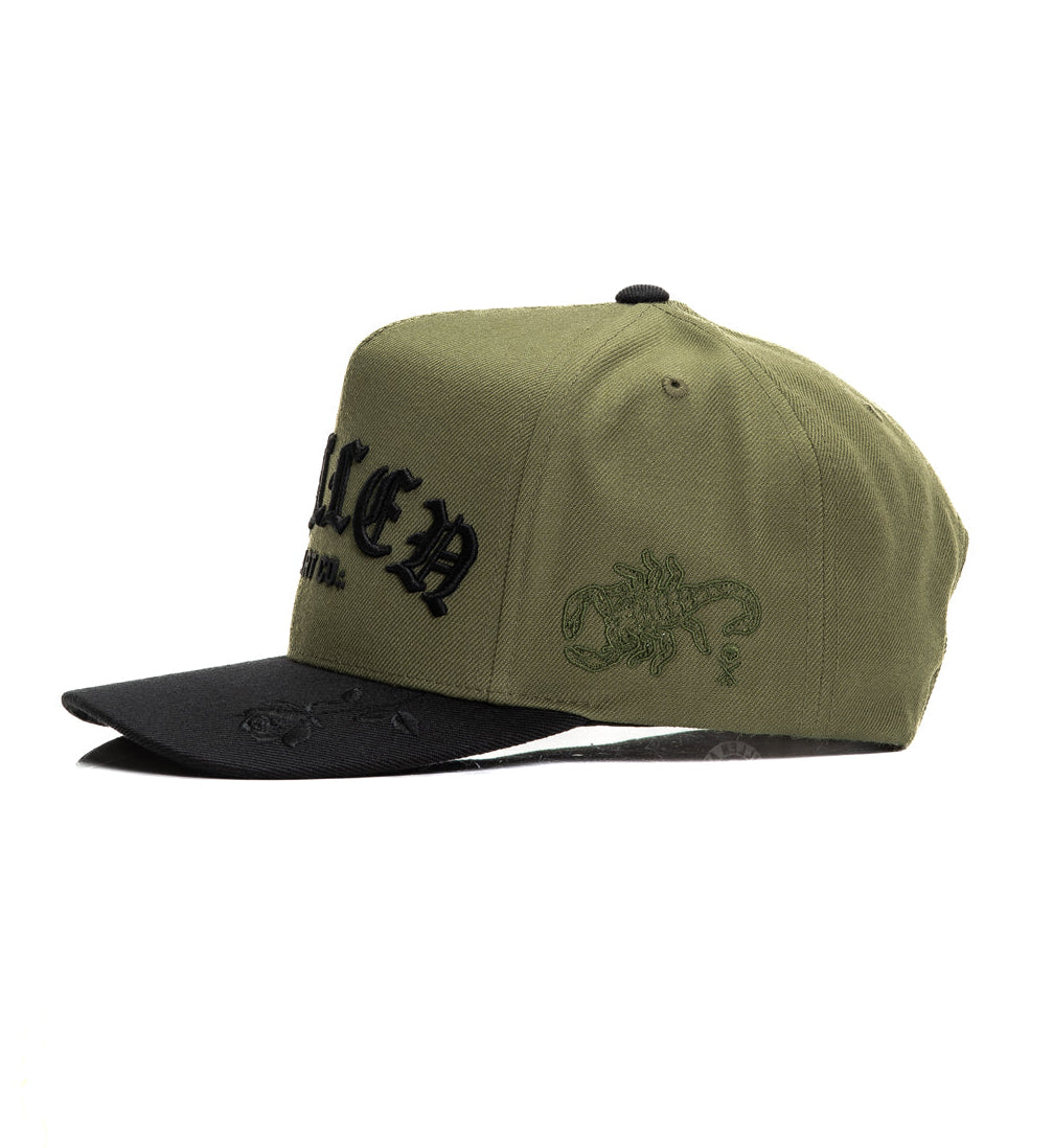 Green cap with black text and logo on a white background